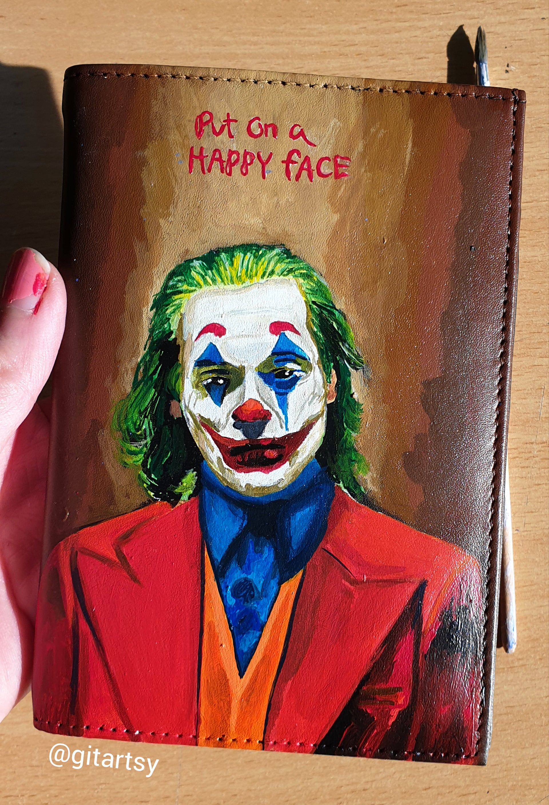 A hand-painted leather wallet featuring a custom portrait of a person, pet, or loved one. The painting is detailed, colourful, and made using premium-quality waterproof leather paints. Ideal for gifting or personal keepsakes, this wallet showcases artistic craftsmanship and premium leatherwork.

