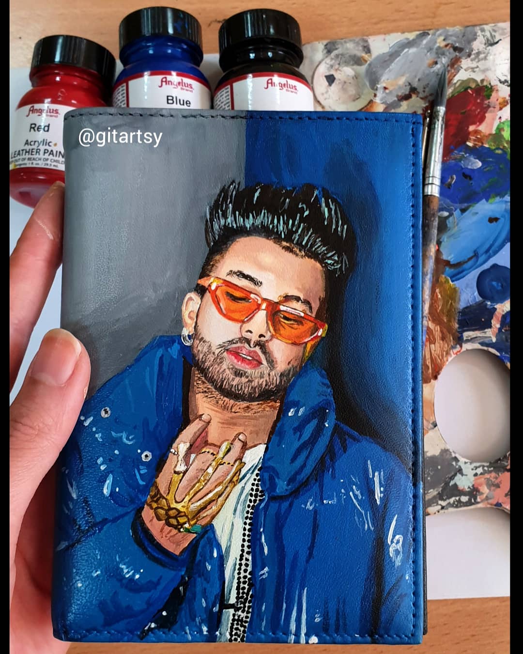 A hand-painted leather wallet featuring a custom portrait of a person, pet, or loved one. The painting is detailed, colourful, and made using premium-quality waterproof leather paints. Ideal for gifting or personal keepsakes, this wallet showcases artistic craftsmanship and premium leatherwork.

