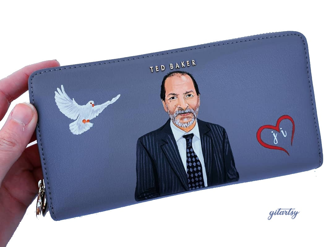 A hand-painted leather wallet featuring a custom portrait of a person, pet, or loved one. The painting is detailed, colourful, and made using premium-quality waterproof leather paints. Ideal for gifting or personal keepsakes, this wallet showcases artistic craftsmanship and premium leatherwork.

