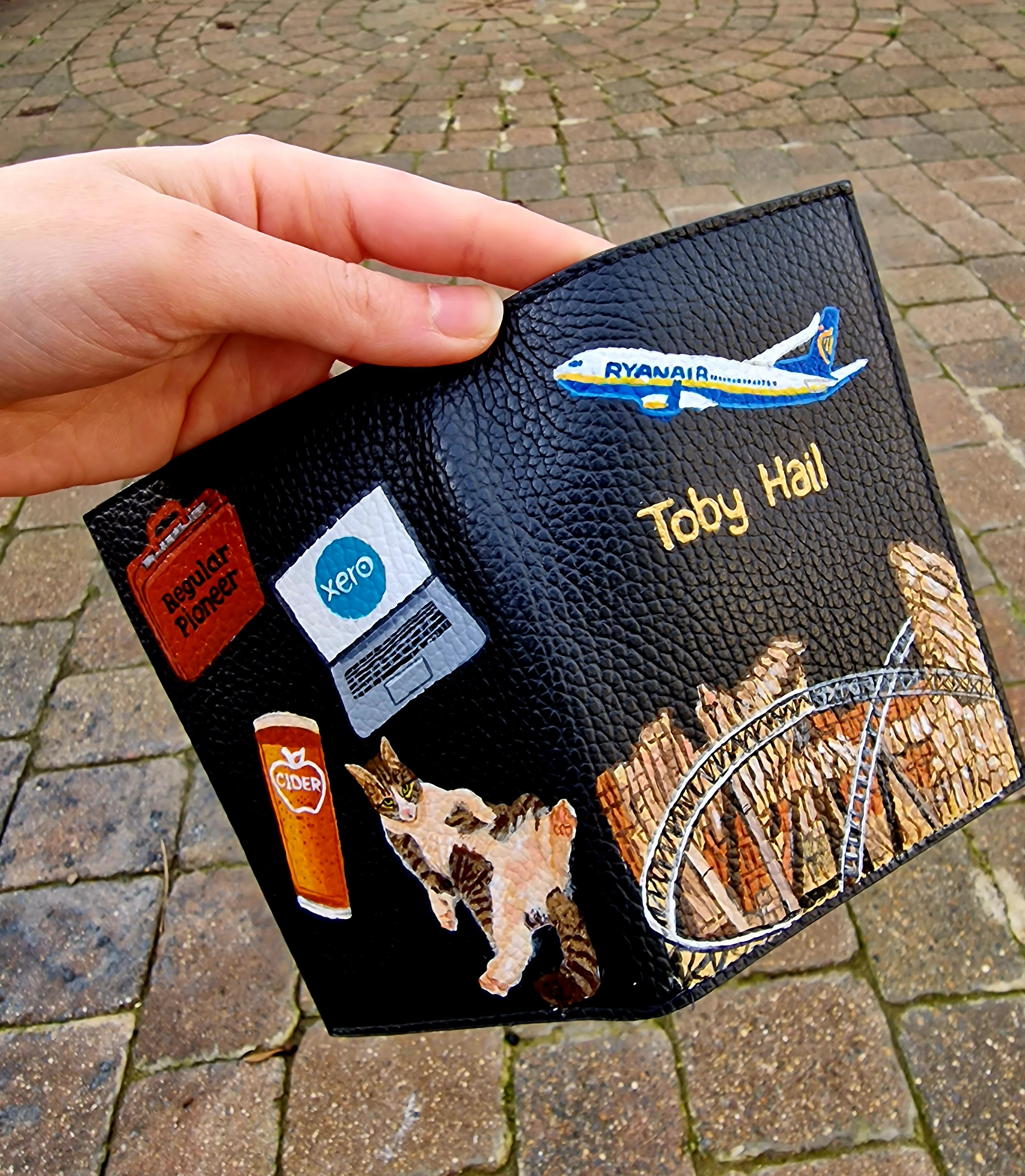 A hand-painted leather wallet featuring a custom portrait of a person, pet, or loved one. The painting is detailed, colourful, and made using premium-quality waterproof leather paints. Ideal for gifting or personal keepsakes, this wallet showcases artistic craftsmanship and premium leatherwork.

