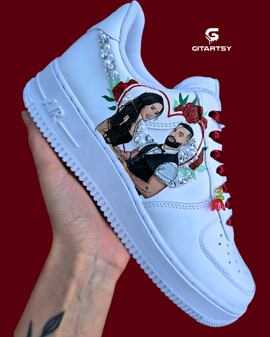 A white custom sneaker with a graphic illustration of a couple, red roses, heart border propsal photo and rhinestone embellishments, The brand name 'GITARTSY' is visible in the top right. Colour scheme is red maroon and white black 