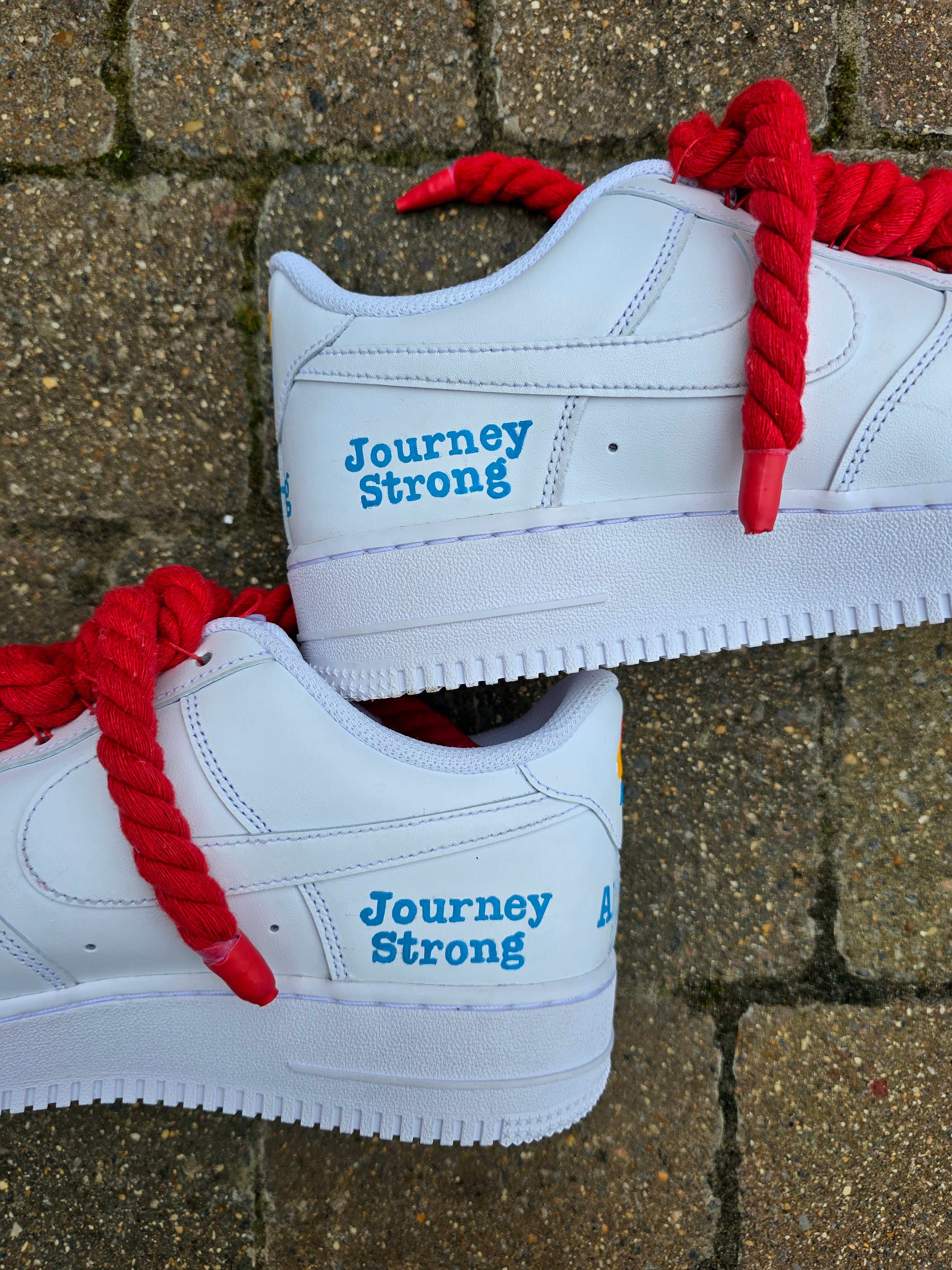 Custom hand-painted Nike Air Force 1 sneakers featuring unique cartoon artwork inspired by the book Who Stole Your Mind? by Being Alphie. The shoes showcase vibrant illustrations, bright yellow swoosh drips, thick red rope laces, and hand-lettered text on premium leather for book lovers, art collectors, and streetwear fans.

