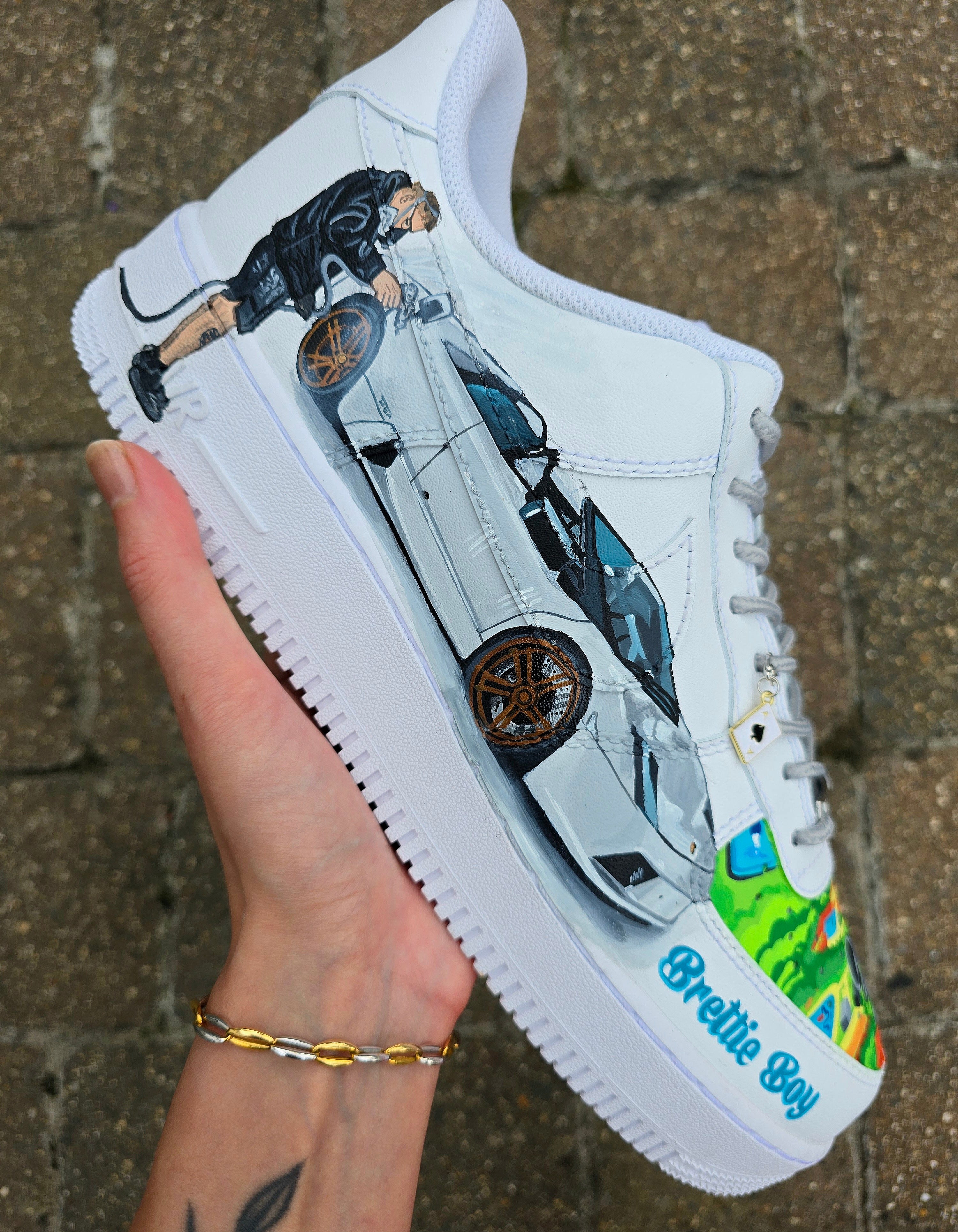 Custom hand-painted Nike Air Force 1 sneakers featuring a Lamborghini-inspired design 🏎️ and spray painter artwork 🎨. Created by Gitartsy using premium leather paints, sealed for durability, and fully customisable with personal details such as car models, colors, and text. Perfect for car enthusiasts 🚗, sneaker collectors 👟, and streetwear lovers seeking one-of-a-kind footwear.

