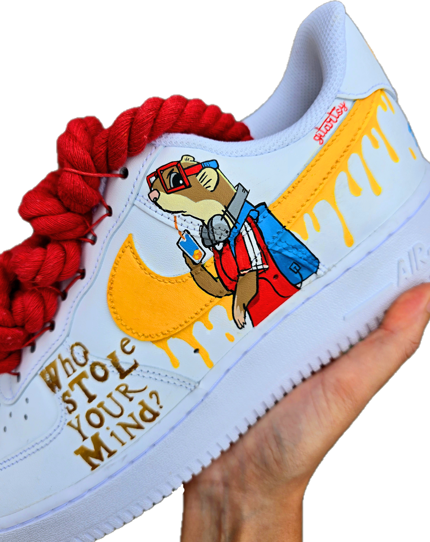Custom hand-painted Nike Air Force 1 sneakers featuring unique cartoon artwork inspired by the book Who Stole Your Mind? by Being Alphie. The shoes showcase vibrant illustrations, bright yellow swoosh drips, thick red rope laces, and hand-lettered text on premium leather for book lovers, art collectors, and streetwear fans.

