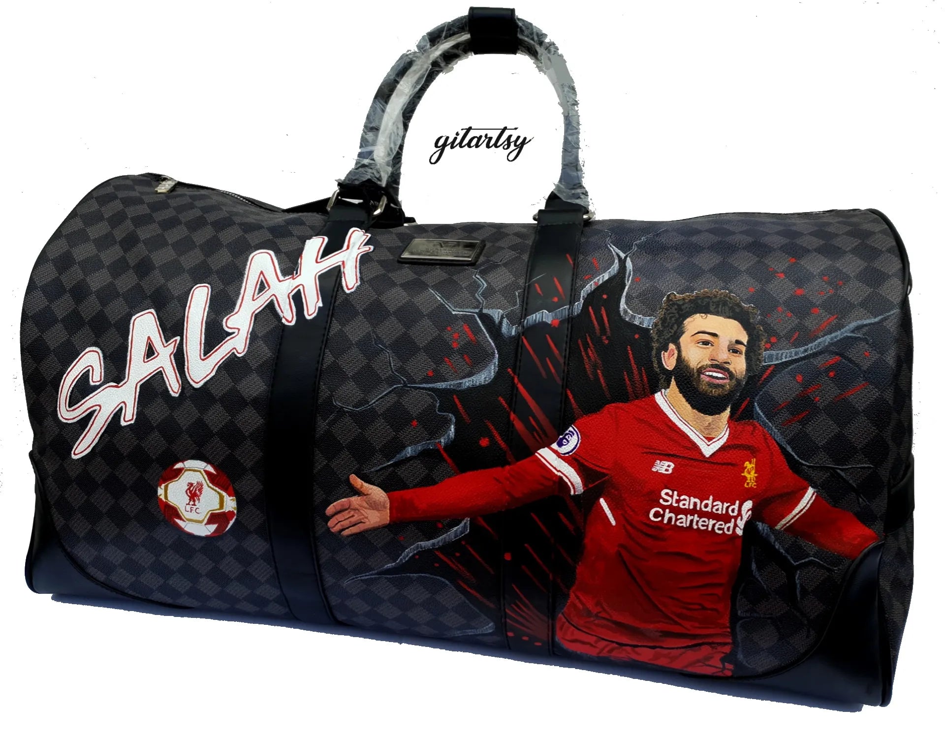 Footballer Mohamed Salah from Liverpool LFC's portrait hand painted on a large duffle bag with his name and a football