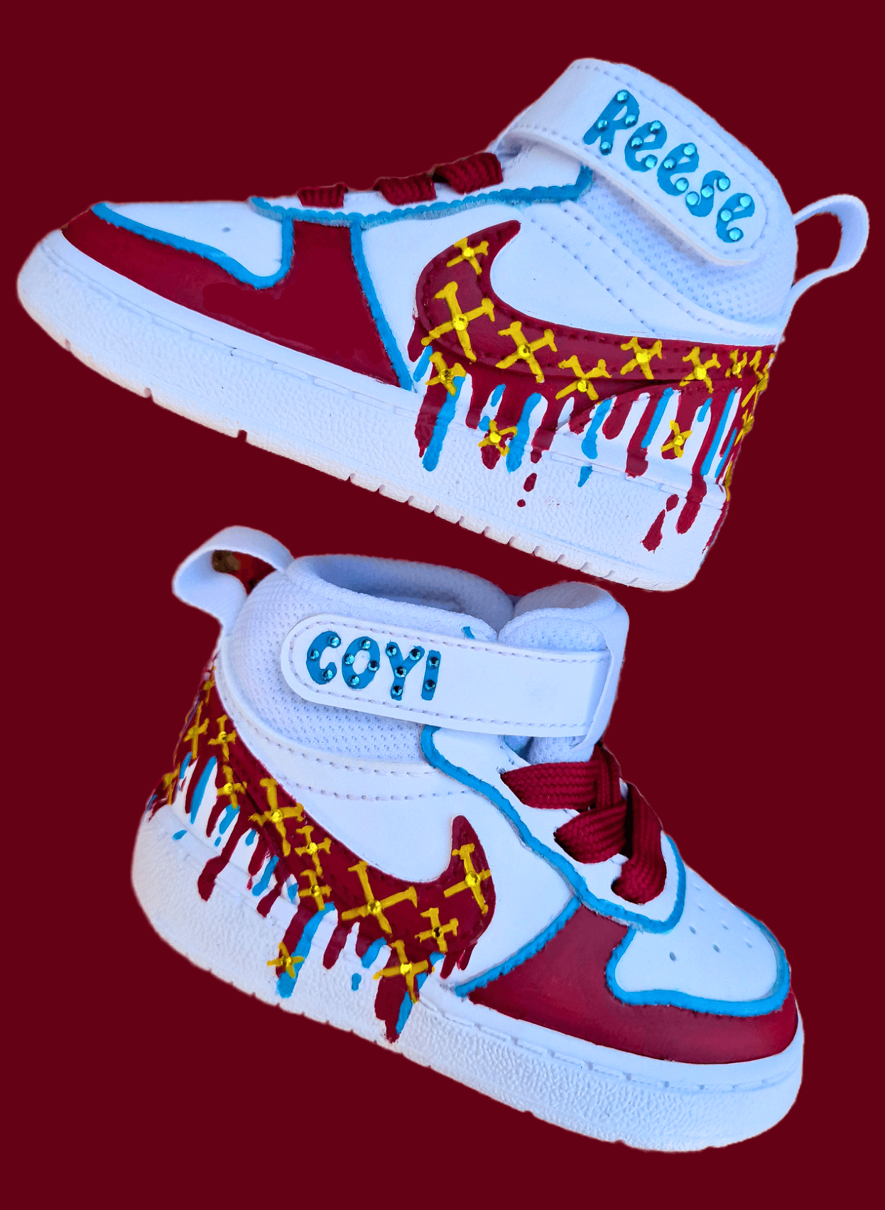Custom hand-painted baby sneakers inspired by West Ham United, featuring claret and blue color detailing, dripping paint effect, crossed hammers, and personalised names or messages on the straps. Perfect for infant football fans and thoughtful baby gifts.

