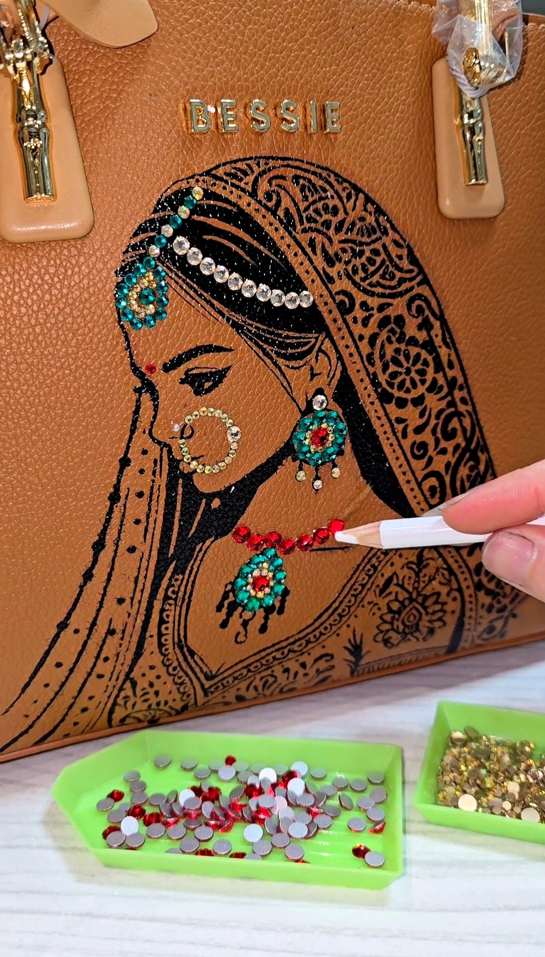 Hand painted bessie London tan brown bag with indian bride illustration and shiny crsystals and rhinestones on the jewellery 
