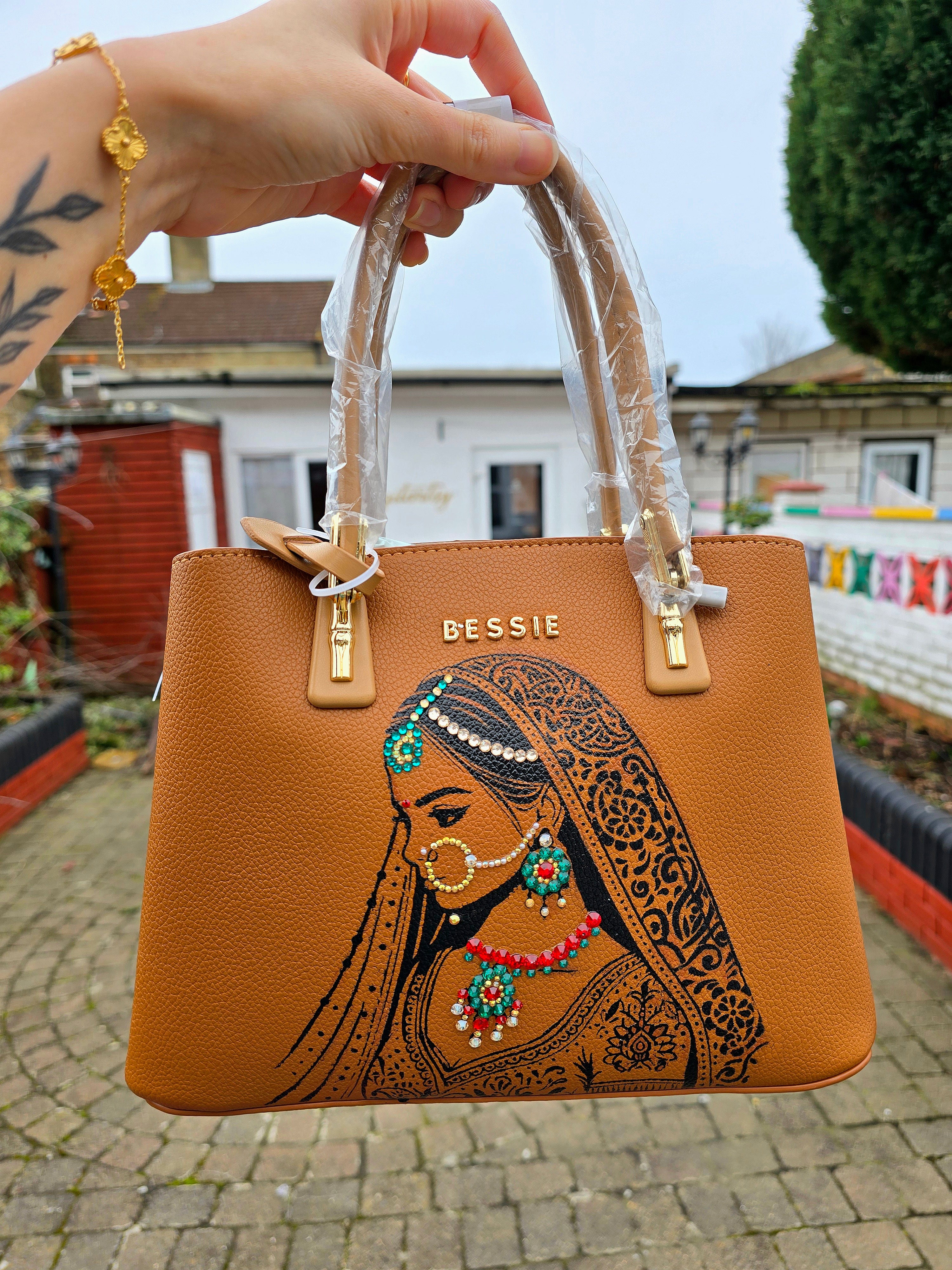 Hand painted bessie London tan brown bag with indian bride illustration and shiny crsystals and rhinestones on the jewellery 