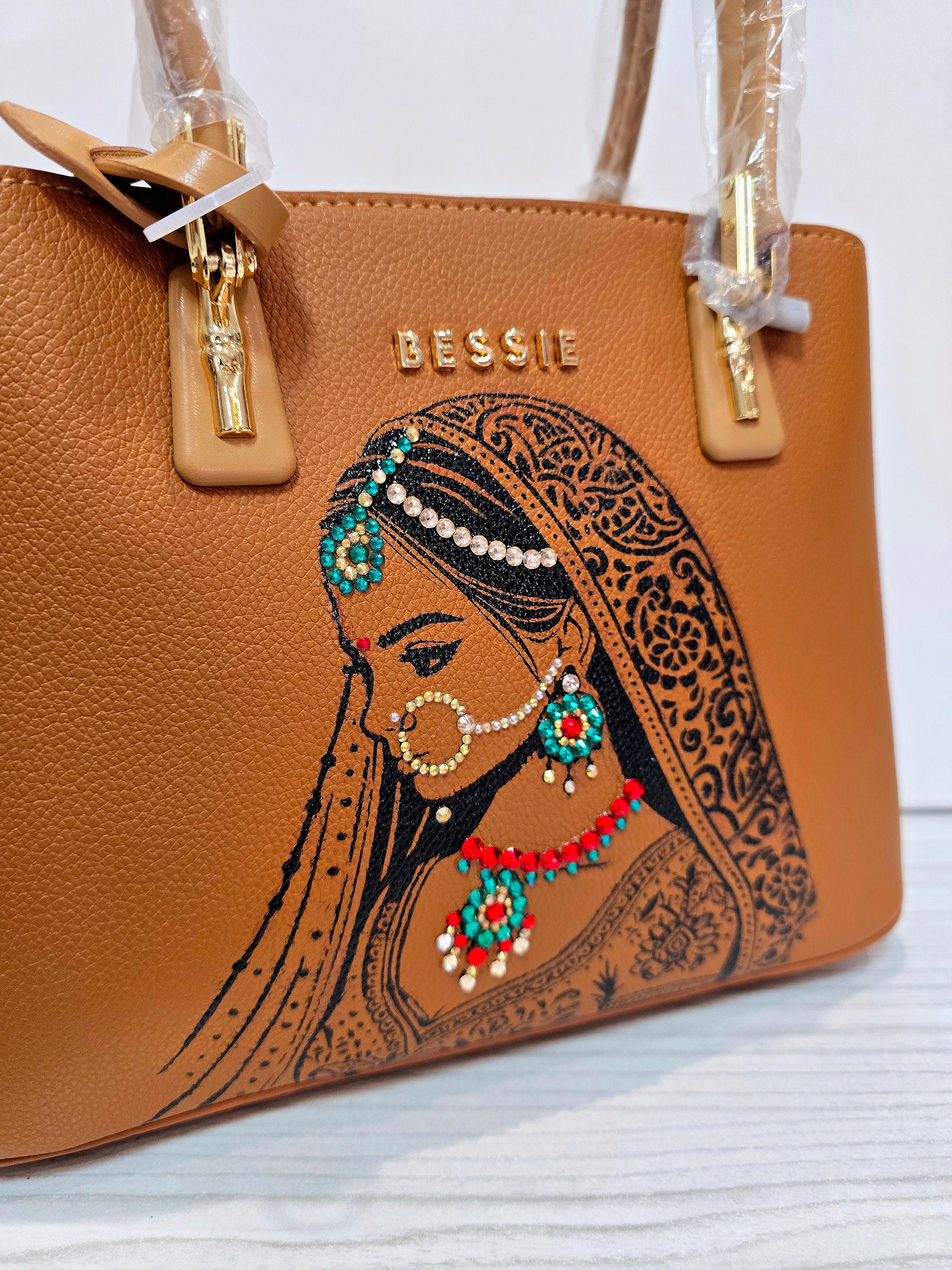 Hand painted bessie London tan brown bag with indian bride illustration and shiny crsystals and rhinestones on the jewellery 