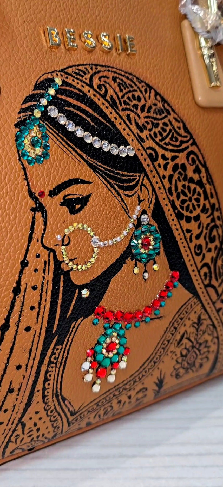 Hand painted bessie London tan brown bag with indian bride illustration and shiny crsystals and rhinestones on the jewellery 