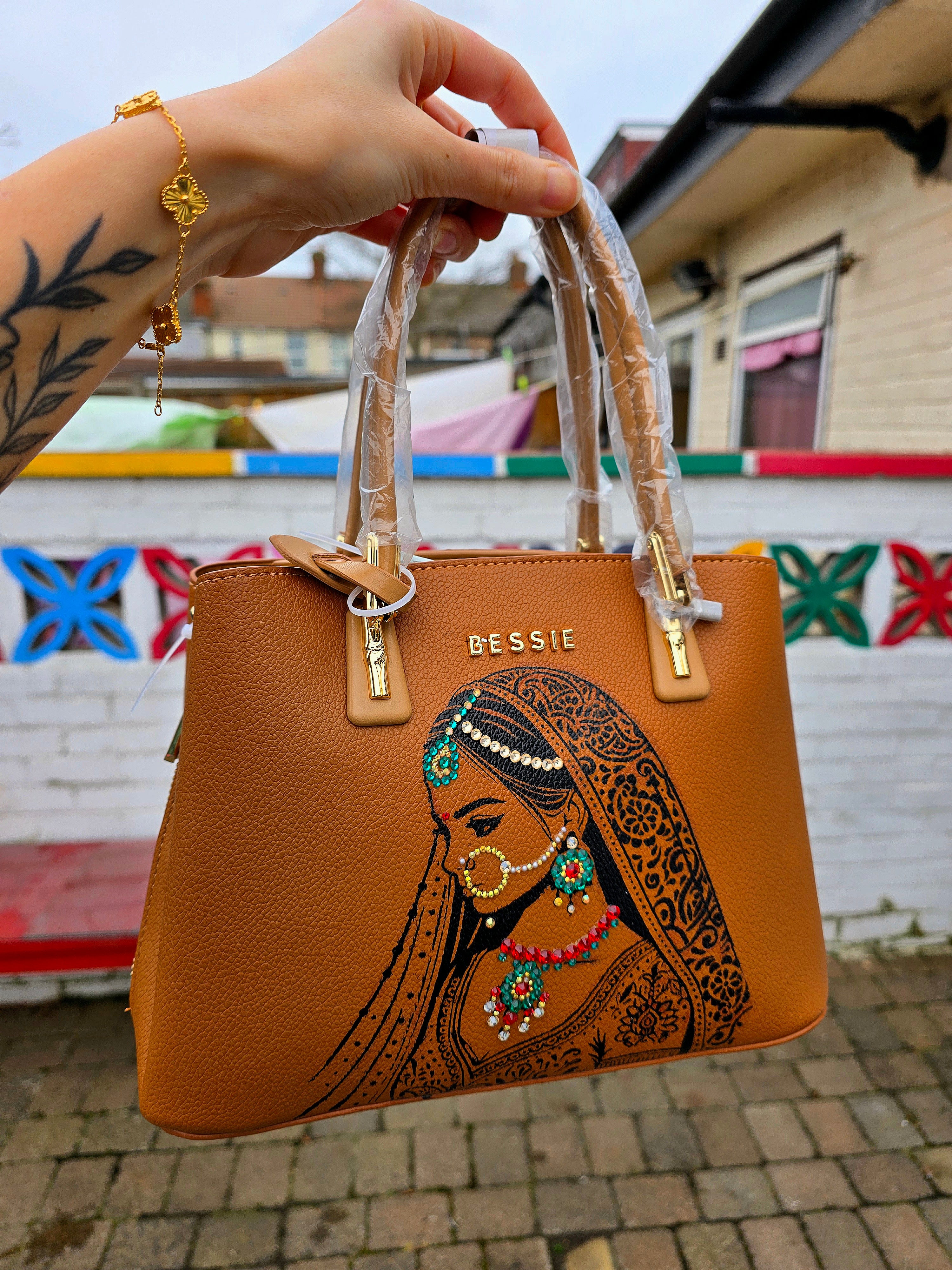 Hand painted bessie London tan brown bag with indian bride illustration and shiny crsystals and rhinestones on the jewellery 
