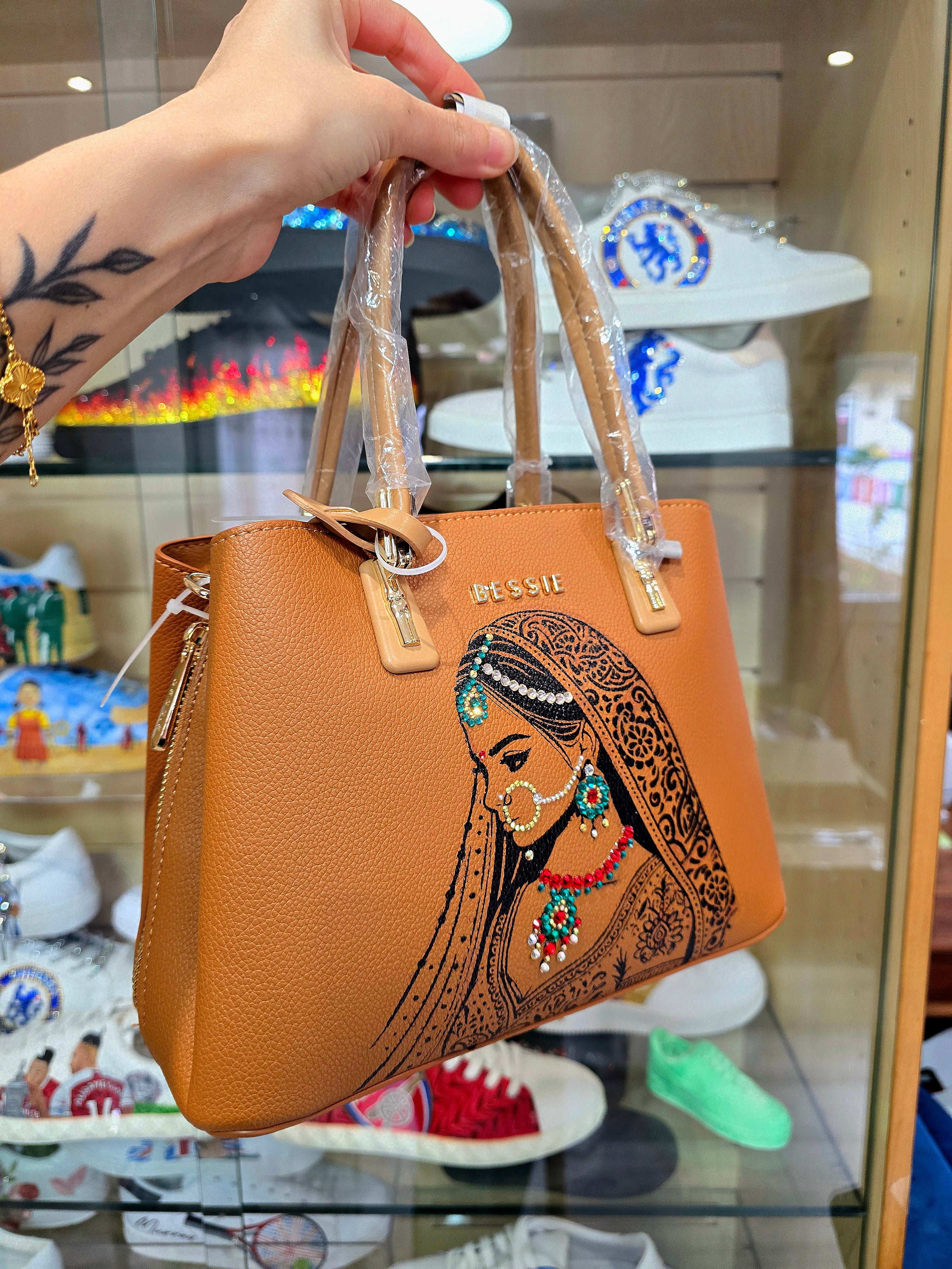 Hand painted bessie London tan brown bag with indian bride illustration and shiny crsystals and rhinestones on the jewellery 