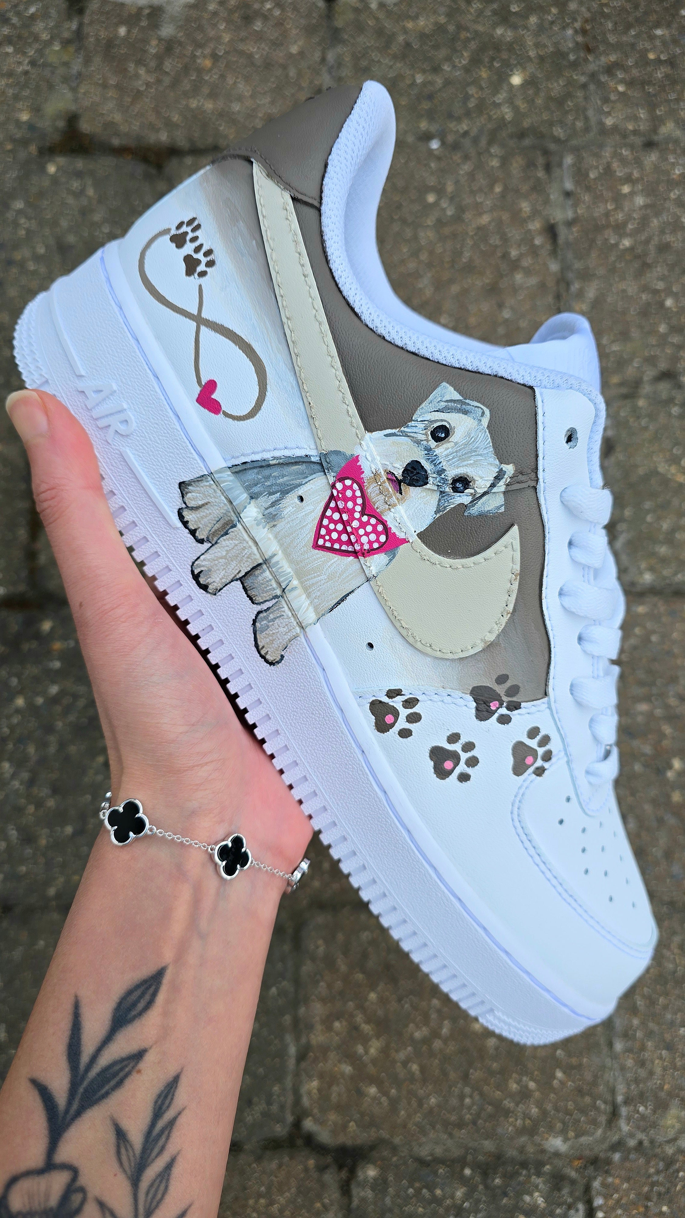 Hand-painted Nike Air Force 1 custom sneakers featuring a realistic pet portrait of “Piper” the dog 🐾, pink or taupe background, heart ❤️ and paw print accents, and personalised name detail, created by Gitartsy.

