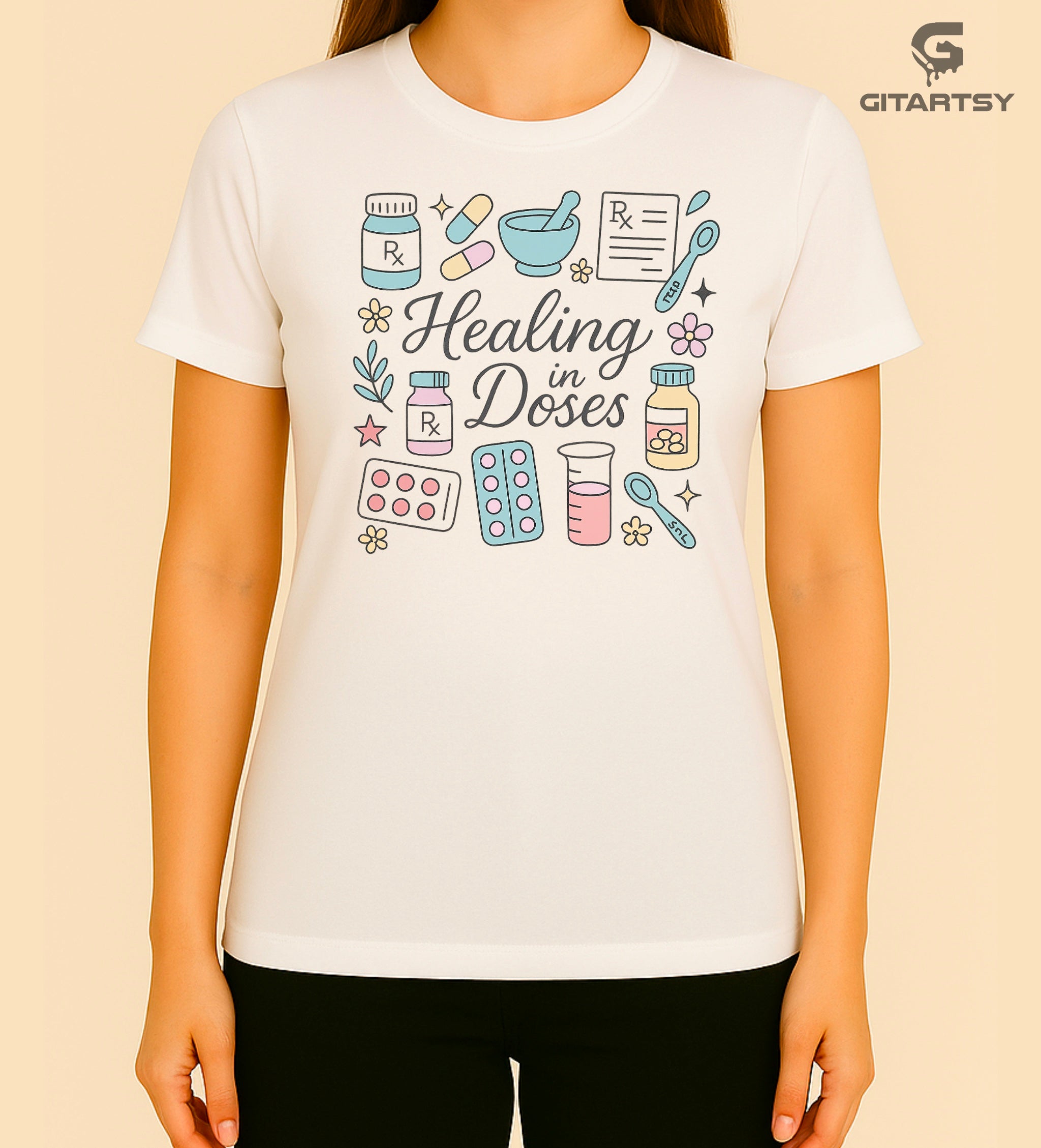 T-shirt with the phrase "Healing in Doses" featuring pastel illustrations of medical elements such as pills, prescription bottles, RX sheets, thermometers, and beakers – ideal for healthcare professionals and pharmacy lovers.