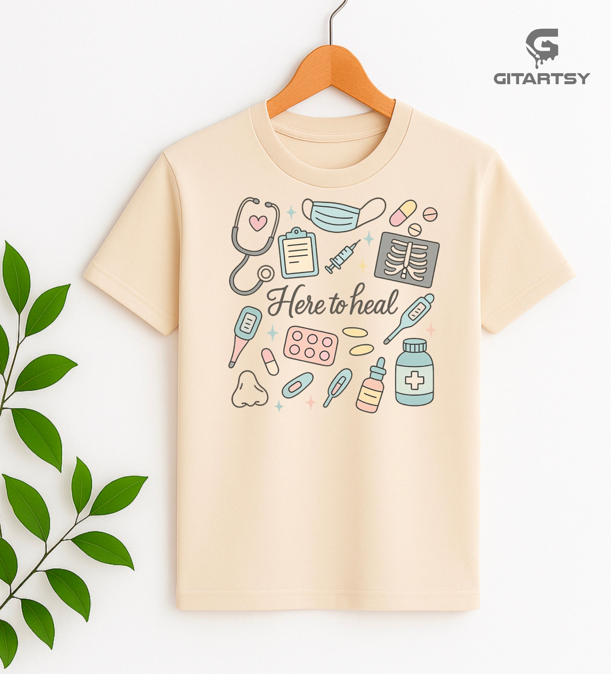 T-shirt with pastel medical illustrations and the phrase “Here to Heal” – ideal for doctors, nurses, and healthcare professionals - beige