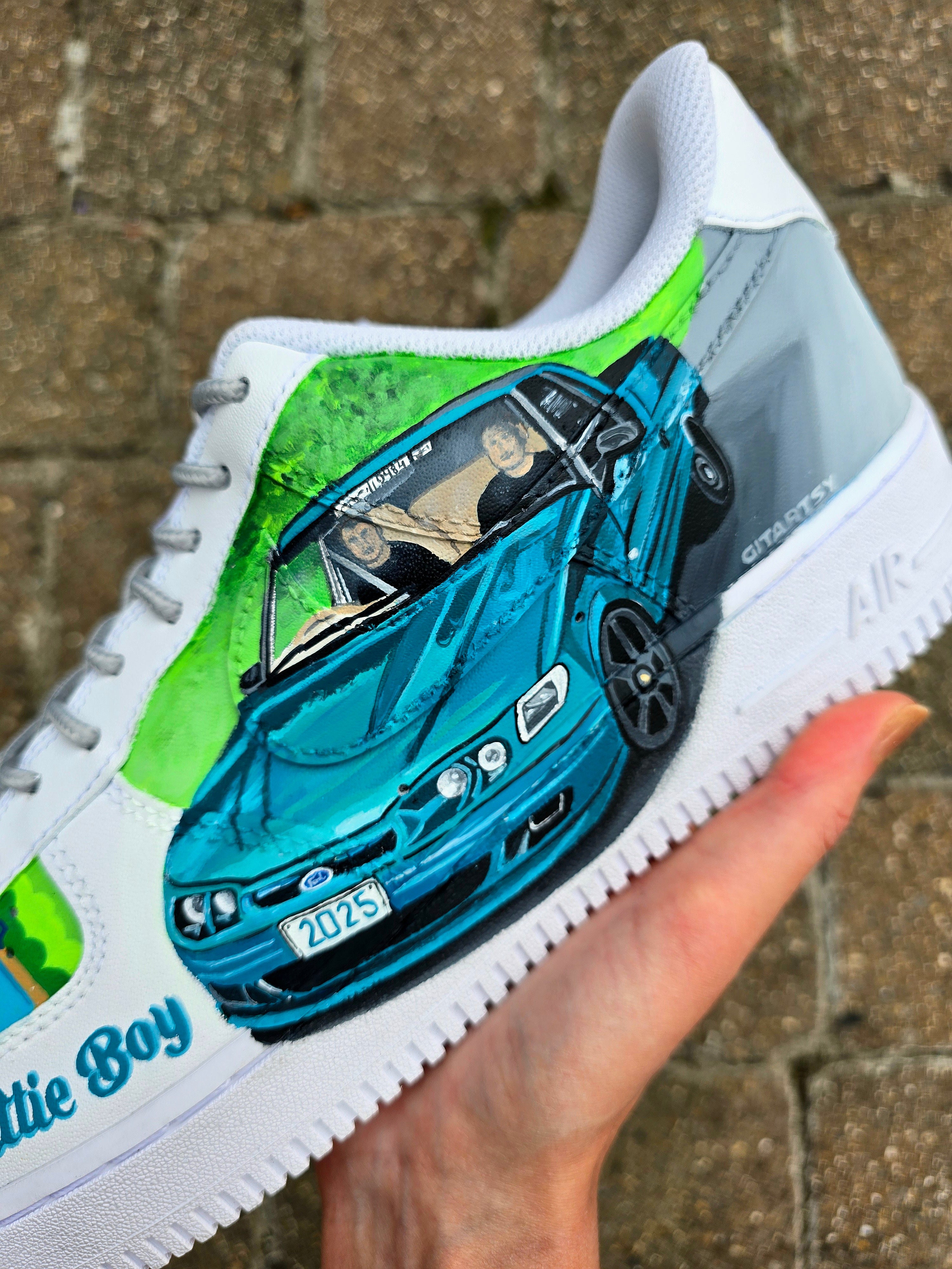 Custom hand-painted Nike Air Force 1 sneakers featuring a Lamborghini-inspired design 🏎️ and spray painter artwork 🎨. Created by Gitartsy using premium leather paints, sealed for durability, and fully customisable with personal details such as car models, colors, and text. Perfect for car enthusiasts 🚗, sneaker collectors 👟, and streetwear lovers seeking one-of-a-kind footwear.

