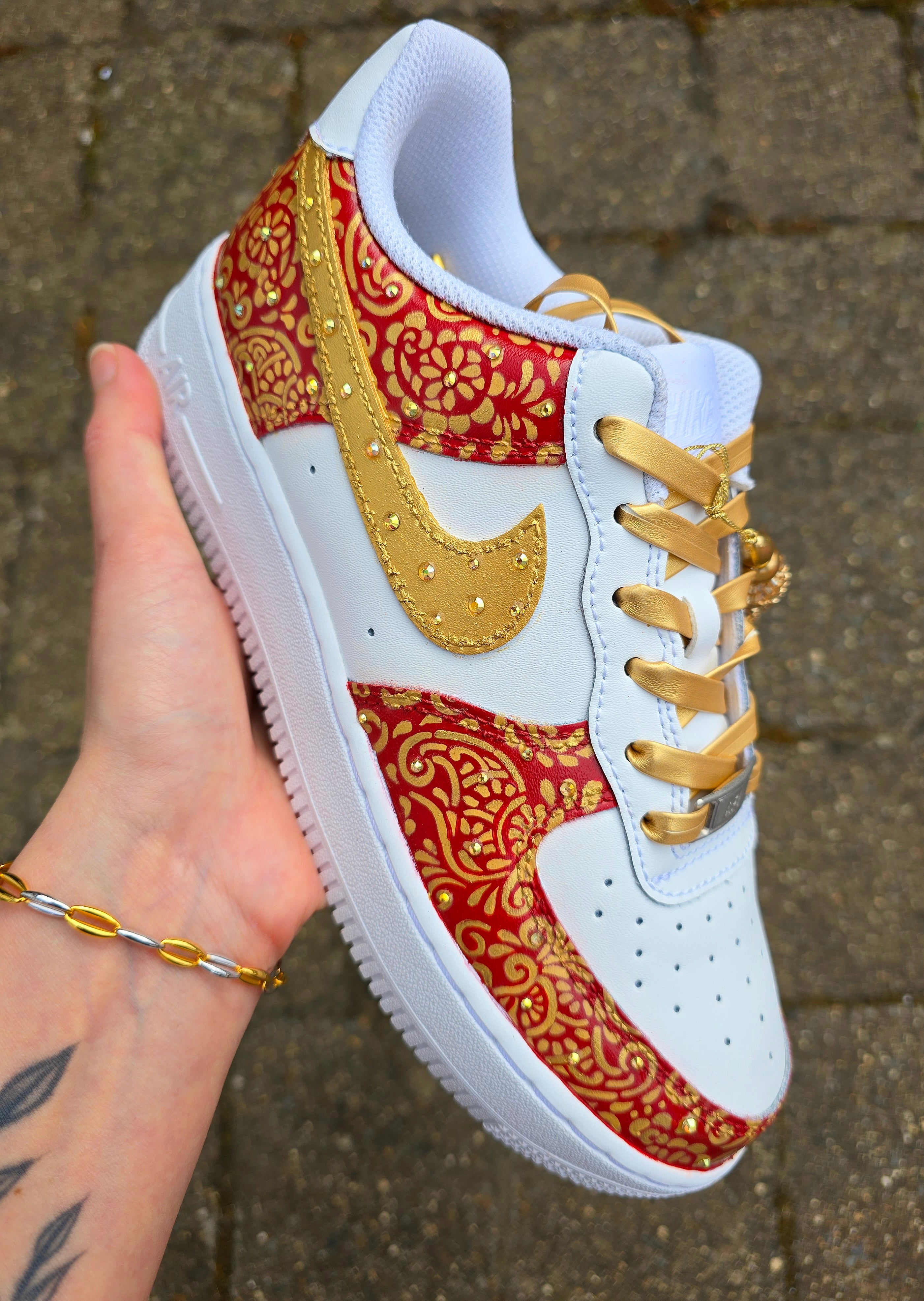 Indian Bridal Wedding Nike AF1 sneakers with crystals -  hand painted with henna mehendi designs in maroon and gold. Topped with rhinestones and paranda 