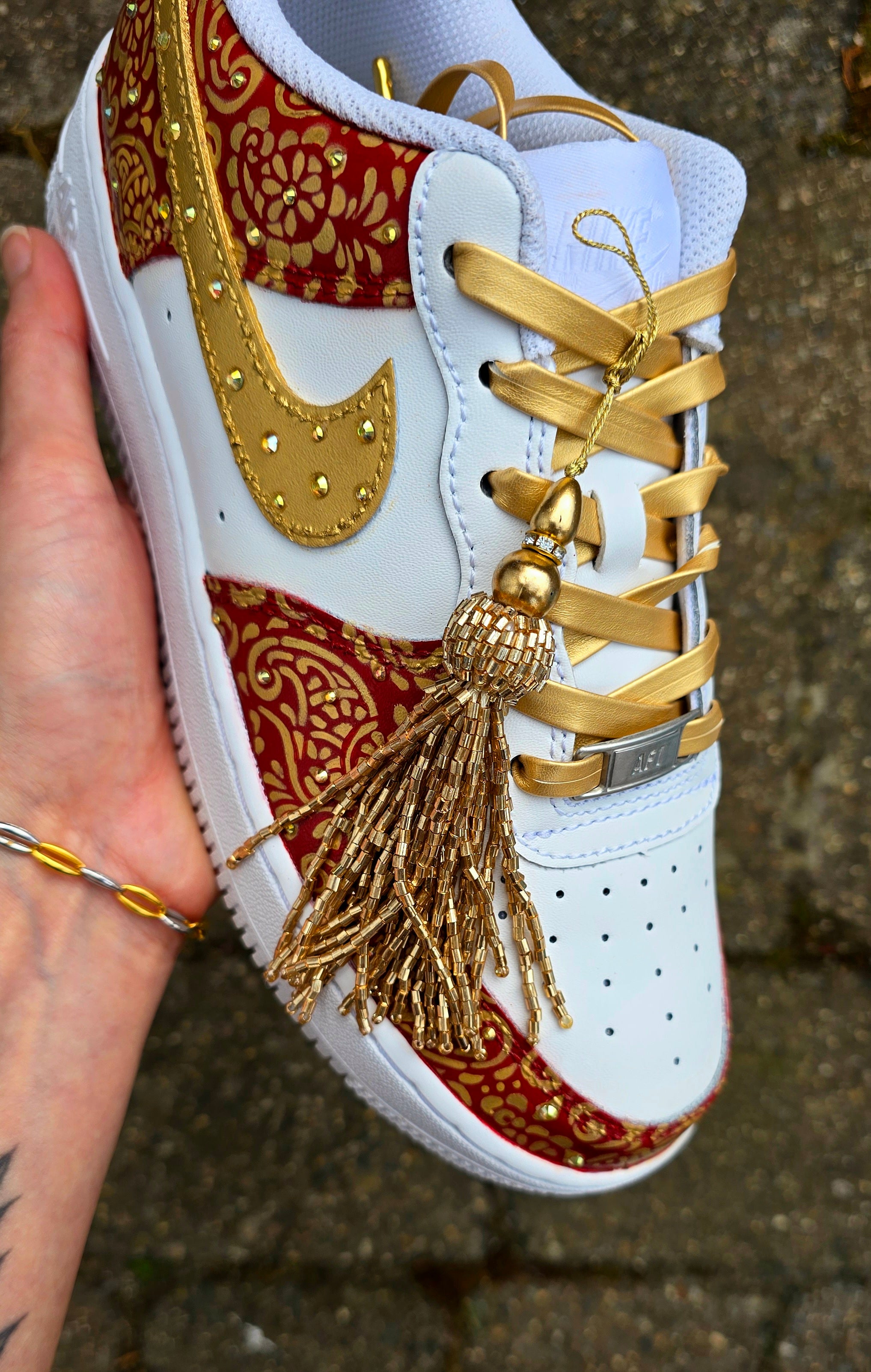 Indian Bridal Wedding Nike AF1 sneakers with crystals -  hand painted with henna mehendi designs in maroon and gold. Topped with rhinestones and paranda 