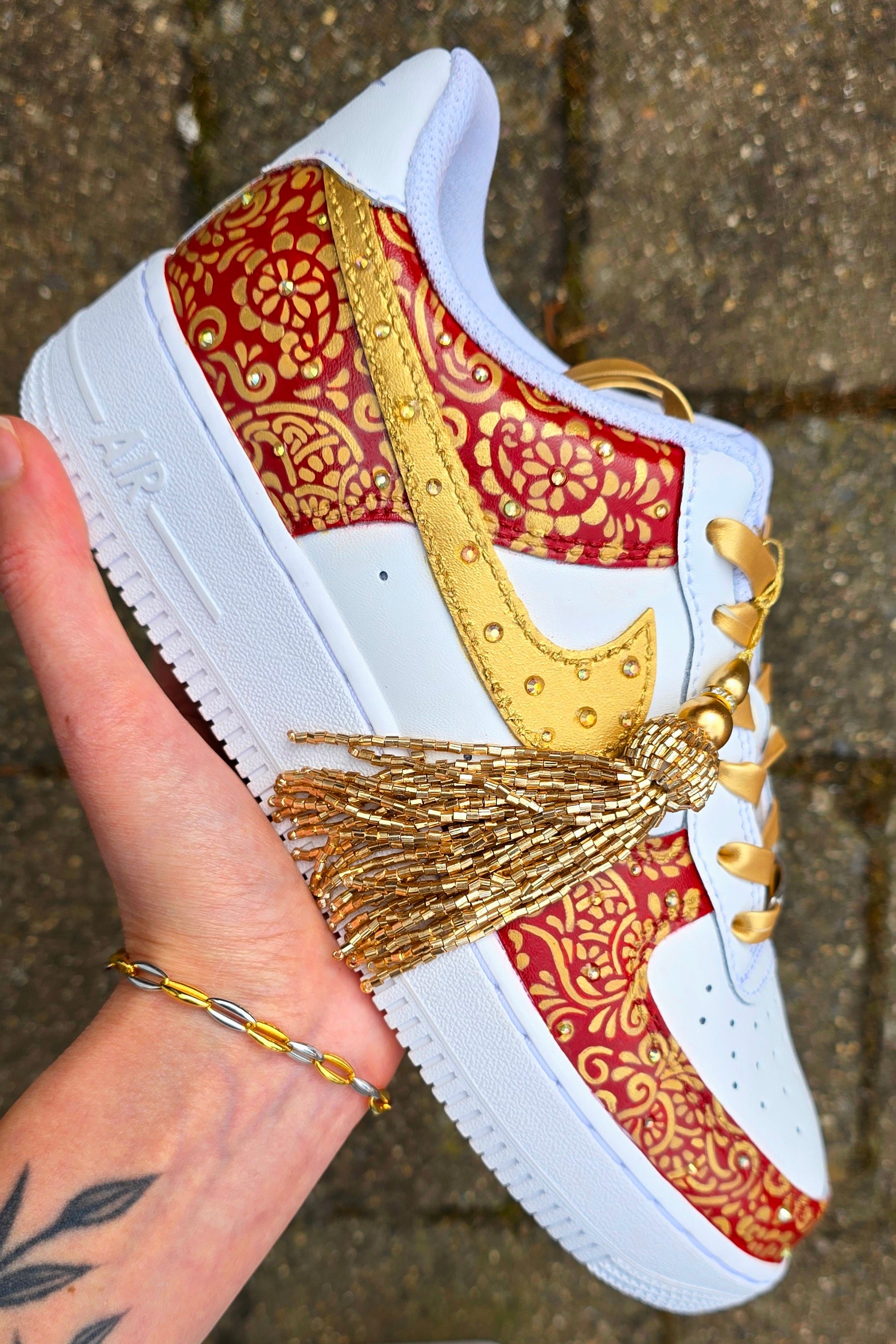 Indian Bridal Wedding Nike AF1 sneakers with crystals -  hand painted with henna mehendi designs in maroon and gold. Topped with rhinestones and paranda 