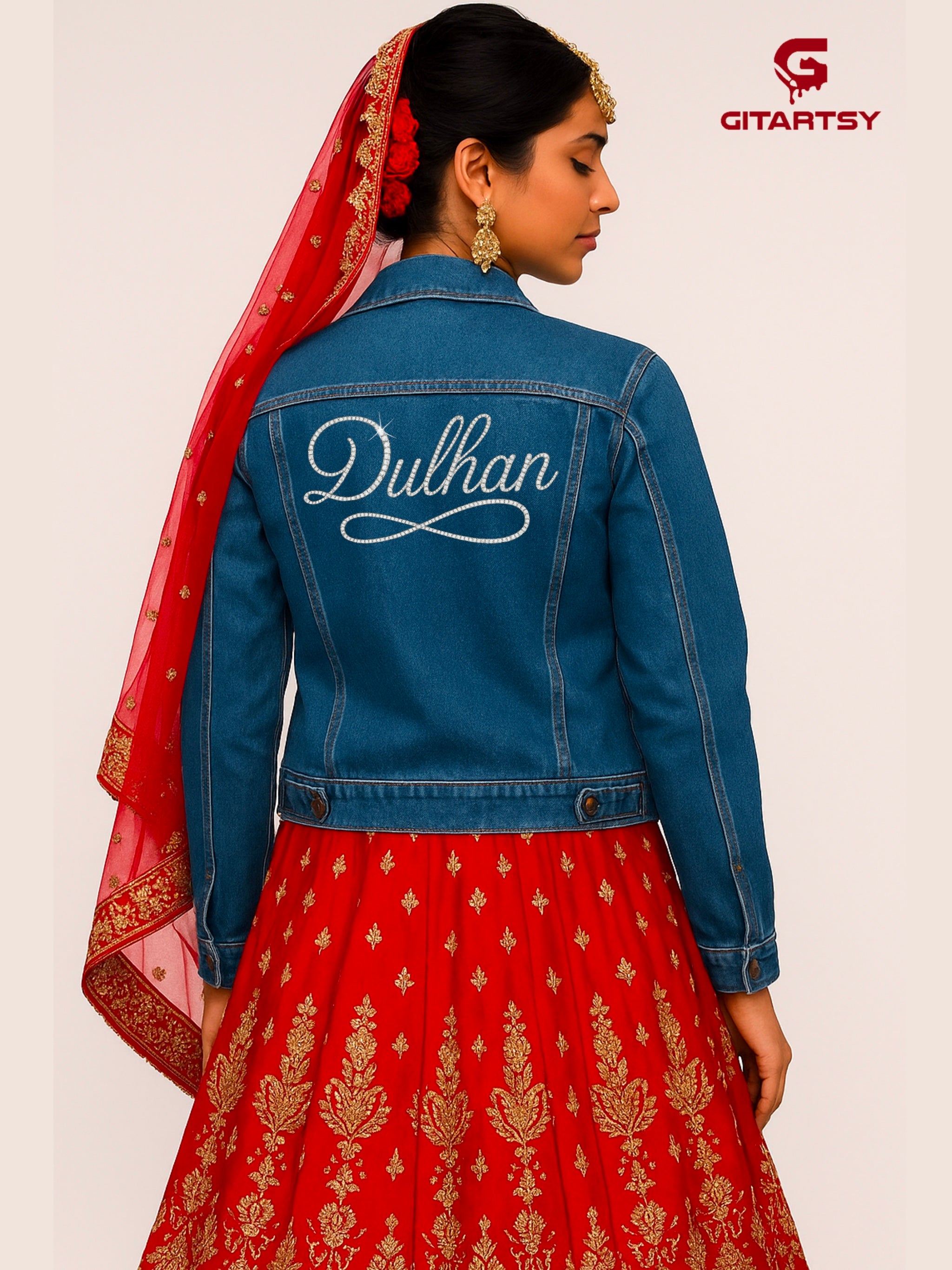 Custom “Dulhan” Denim Jacket for Indian Brides – Crystal Embellished in Gold or Silver – Handmade Bridal blue denim Jacket. Model wearing jacket over indian bridal red lehenga 