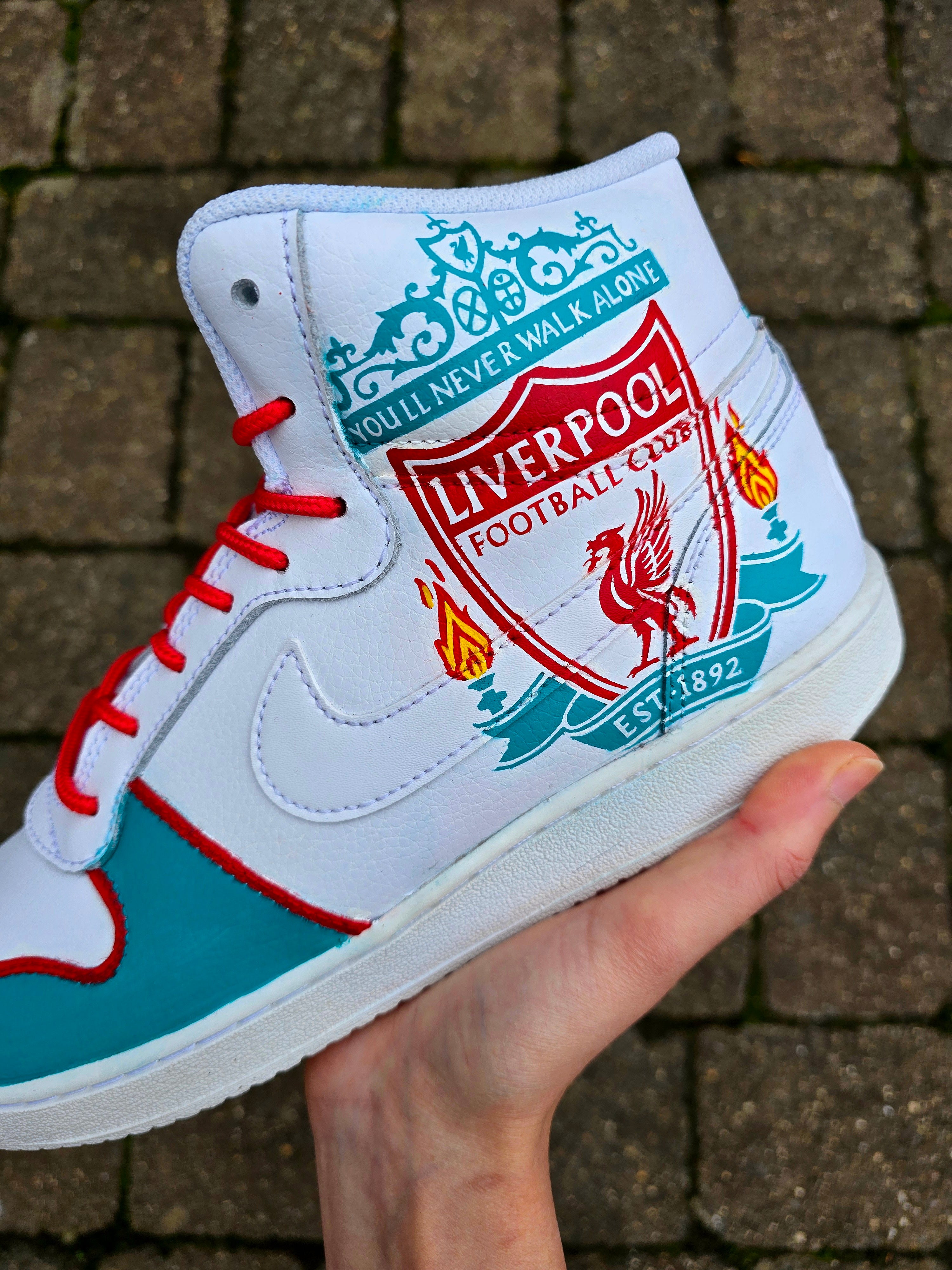Custom hand-painted Liverpool FC Michael Owen sneakers featuring a realistic portrait of Michael Owen in a red Liverpool kit, the club crest with the You’ll Never Walk Alone motto, and vivid accents in red and teal. These unique fan art shoes are waterproof, scratch-resistant, and perfect for Liverpool supporters and collectors who want a standout piece of wearable art.

