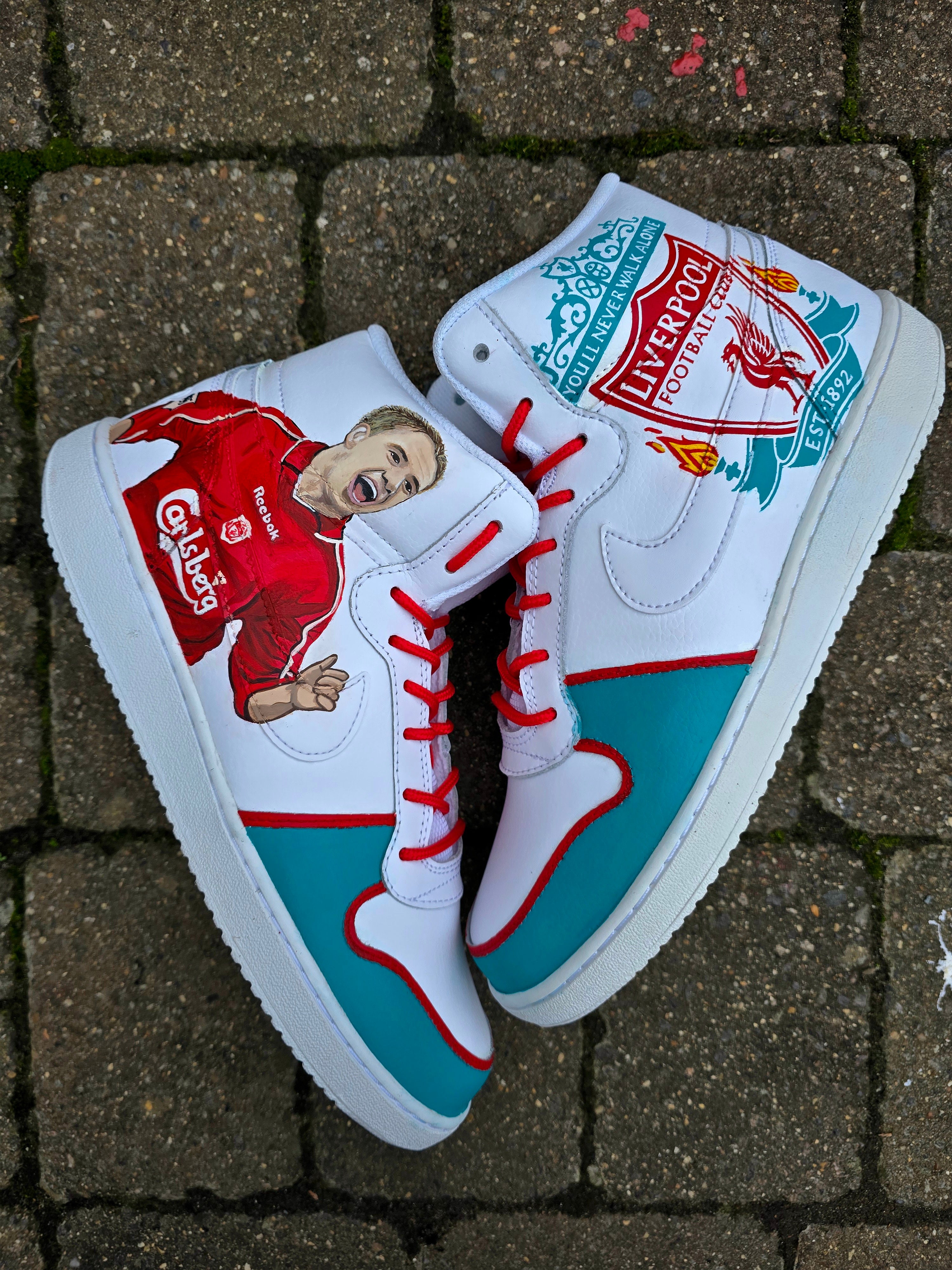 Custom hand-painted Liverpool FC Michael Owen sneakers featuring a realistic portrait of Michael Owen in a red Liverpool kit, the club crest with the You’ll Never Walk Alone motto, and vivid accents in red and teal. These unique fan art shoes are waterproof, scratch-resistant, and perfect for Liverpool supporters and collectors who want a standout piece of wearable art.

