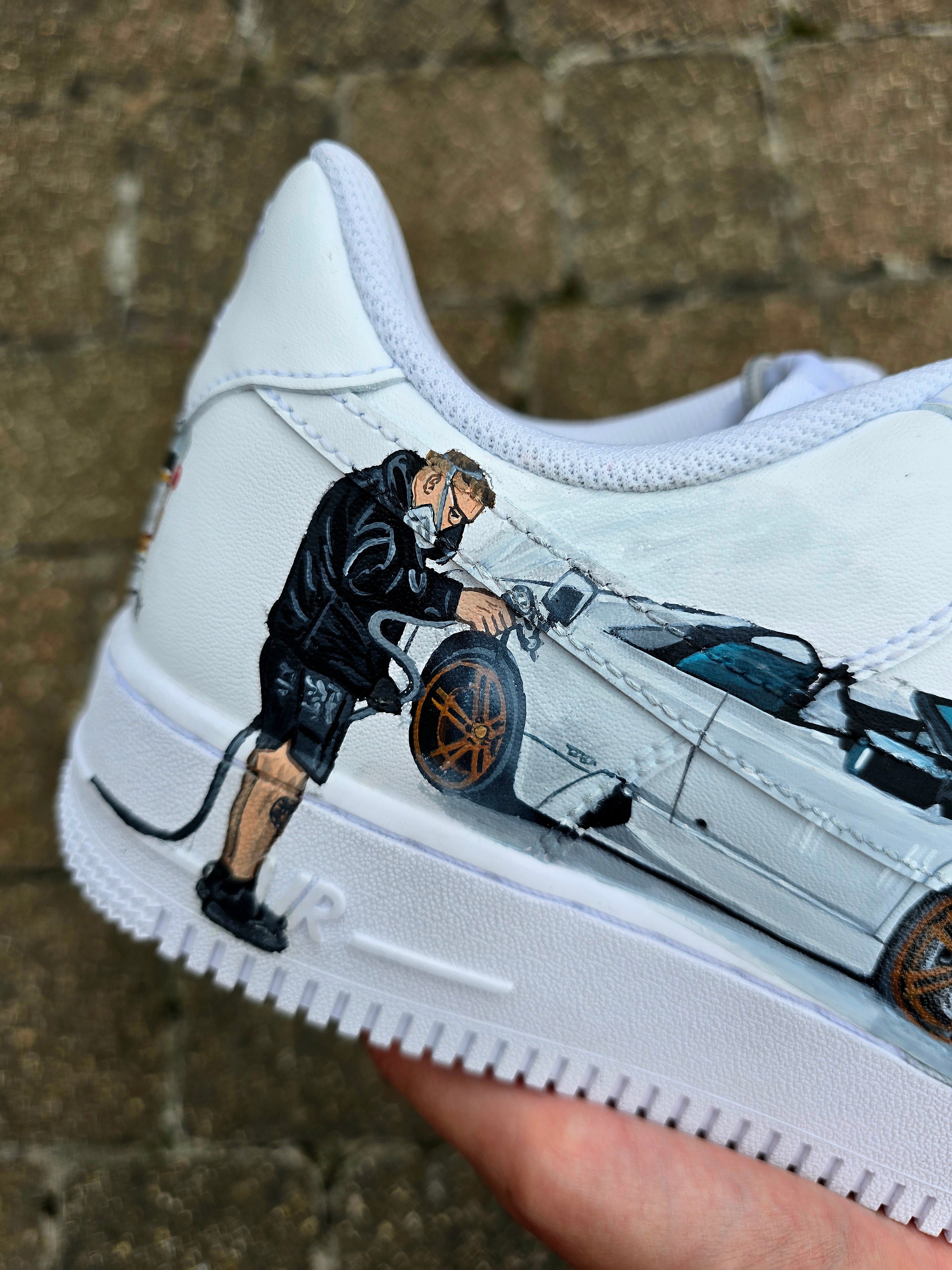Custom hand-painted Nike Air Force 1 sneakers featuring a Lamborghini-inspired design 🏎️ and spray painter artwork 🎨. Created by Gitartsy using premium leather paints, sealed for durability, and fully customisable with personal details such as car models, colors, and text. Perfect for car enthusiasts 🚗, sneaker collectors 👟, and streetwear lovers seeking one-of-a-kind footwear.

