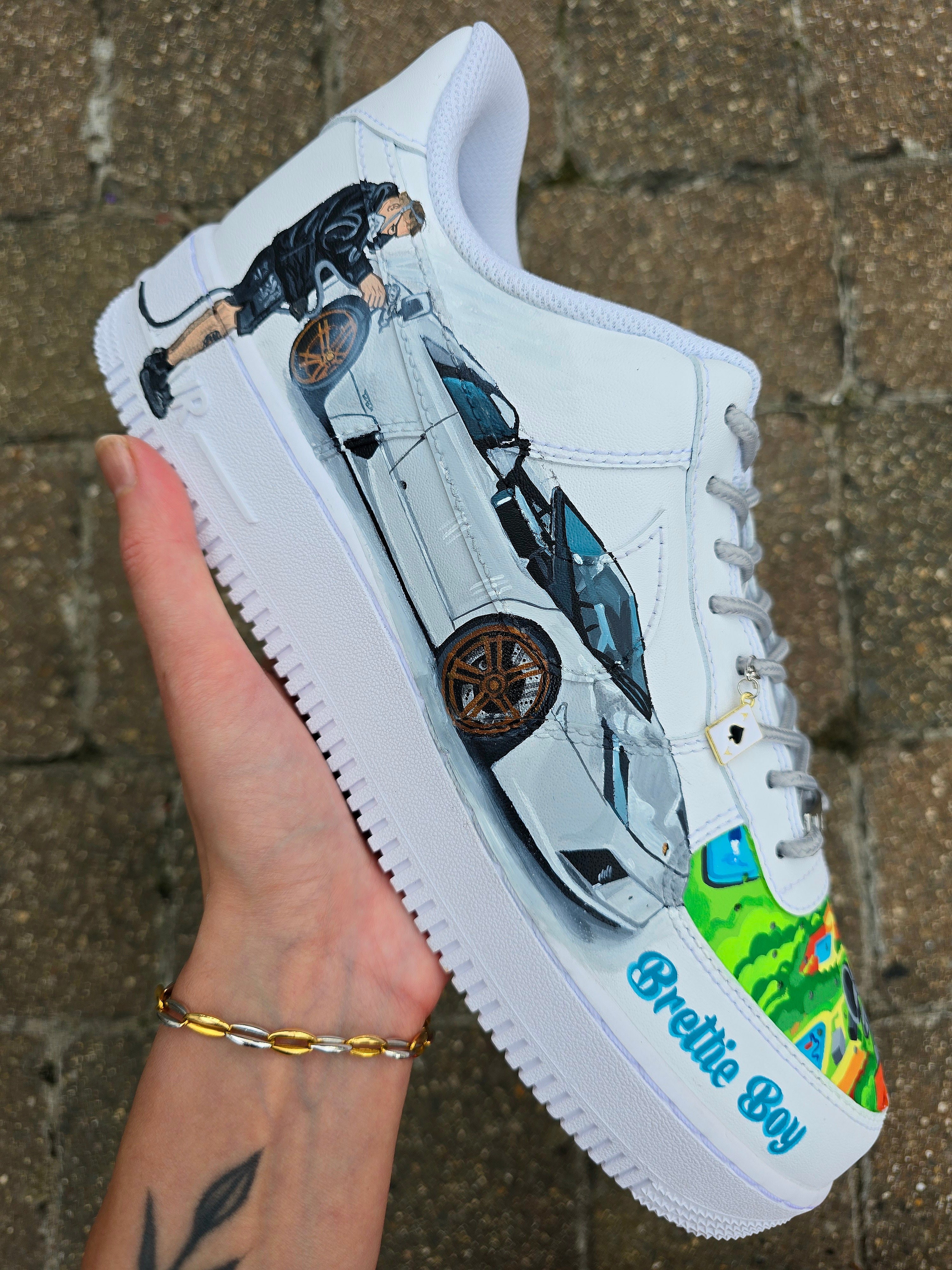 Custom hand-painted Nike Air Force 1 sneakers featuring a Lamborghini-inspired design 🏎️ and spray painter artwork 🎨. Created by Gitartsy using premium leather paints, sealed for durability, and fully customisable with personal details such as car models, colors, and text. Perfect for car enthusiasts 🚗, sneaker collectors 👟, and streetwear lovers seeking one-of-a-kind footwear.

