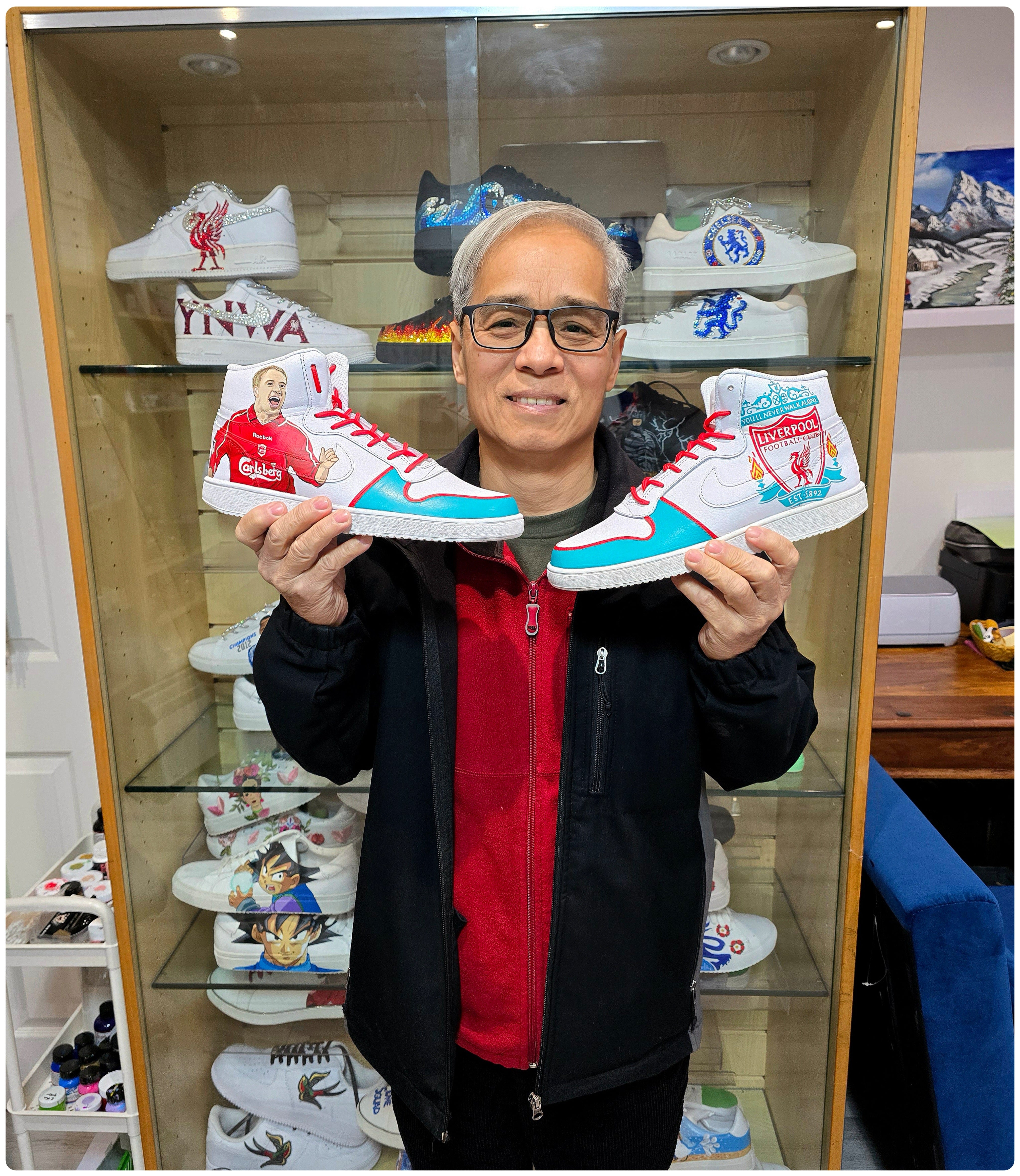 Liverpool fc hand painted nike af1 sneakers held by happy client 