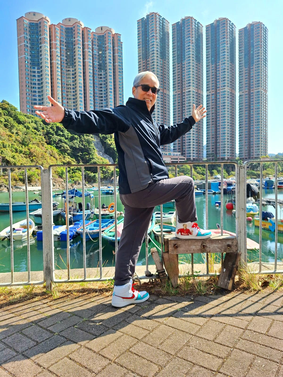 Liverpool fc hand painted nike af1 sneakers held by happy client  in Hong Kong