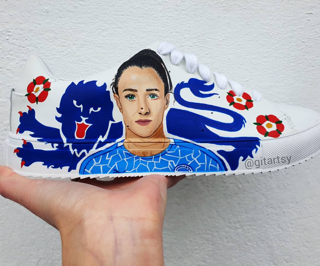 Custom Lucy Bronze Manchester City Hand-Painted Sneakers featuring a realistic portrait of Lucy Bronze, blue club lion emblem, red English rose details, and the iconic Manchester City logo, painted on premium white leather shoes – a unique gift for football fans.

