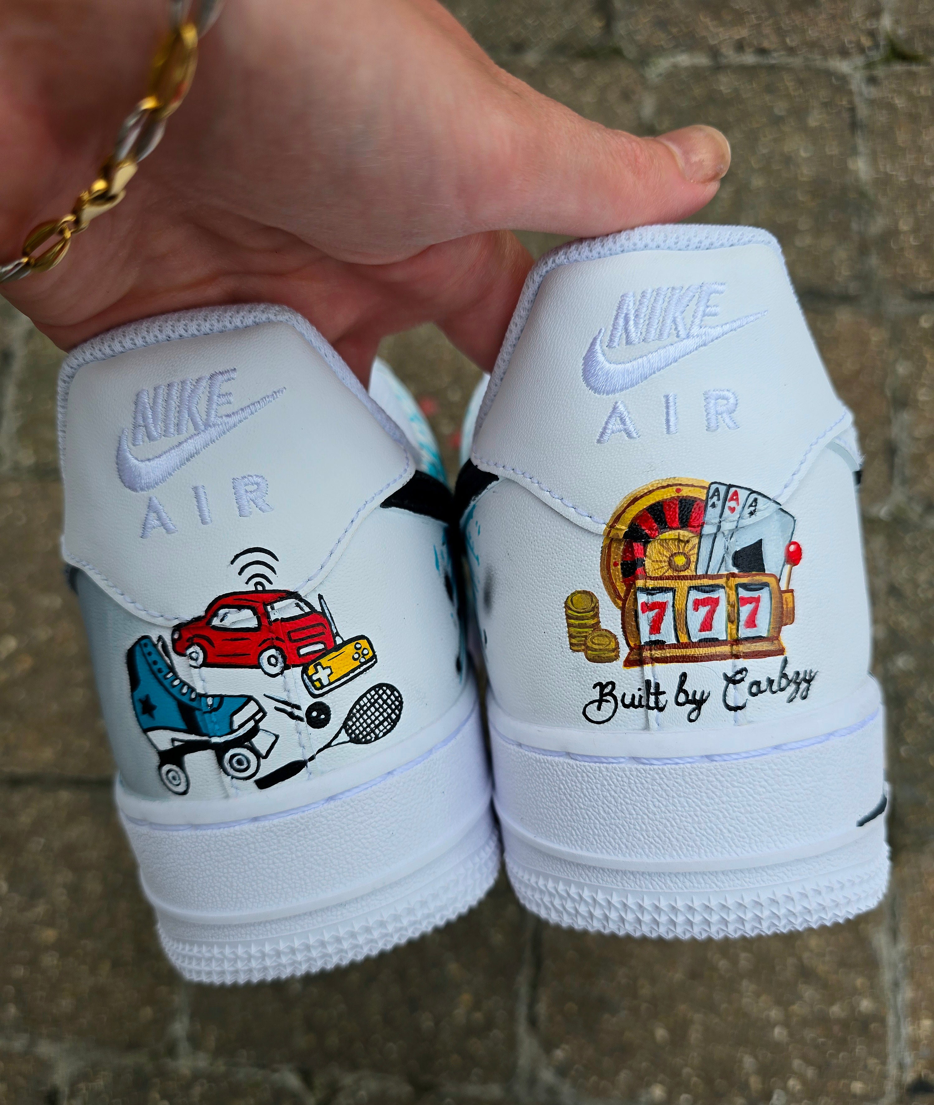 Custom hand-painted Nike Air Force 1 sneakers featuring a Lamborghini-inspired design 🏎️ and spray painter artwork 🎨. Created by Gitartsy using premium leather paints, sealed for durability, and fully customisable with personal details such as car models, colors, and text. Perfect for car enthusiasts 🚗, sneaker collectors 👟, and streetwear lovers seeking one-of-a-kind footwear.

