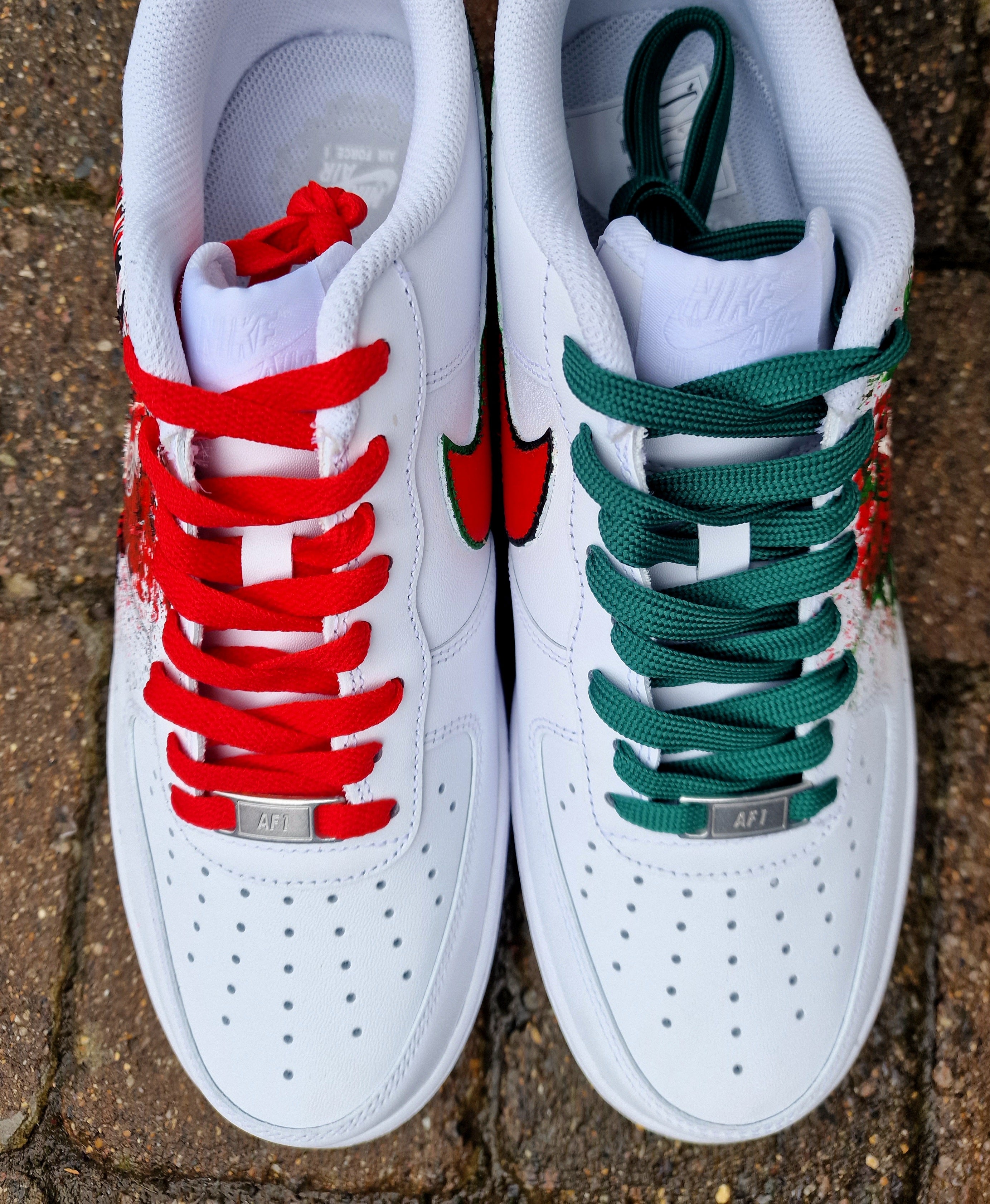 "Custom hand-painted Nike Air Force 1 sneakers featuring Manchester United and Portugal national football team crests, splattered in bold red, green, and black paint with unique details, crafted by Gitartsy."

