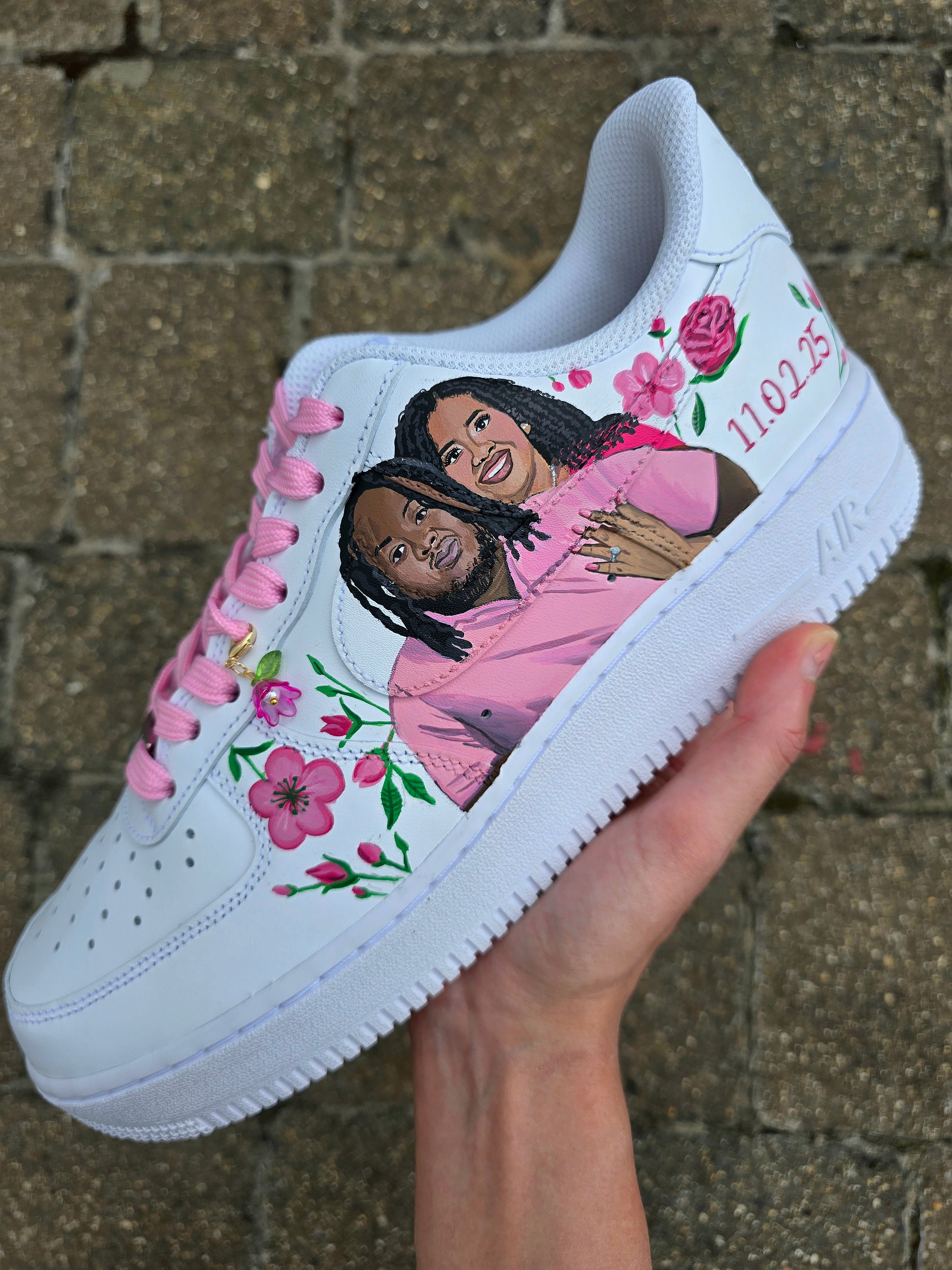 Hand-painted custom Nike Air Force 1 wedding sneakers featuring "Mr. & Mrs." text, pink floral artwork, optional bride and groom portrait, and romantic personalized detailing; ideal for weddings, anniversaries, and bridal events; white AF1 base with pink laces and custom florals.

