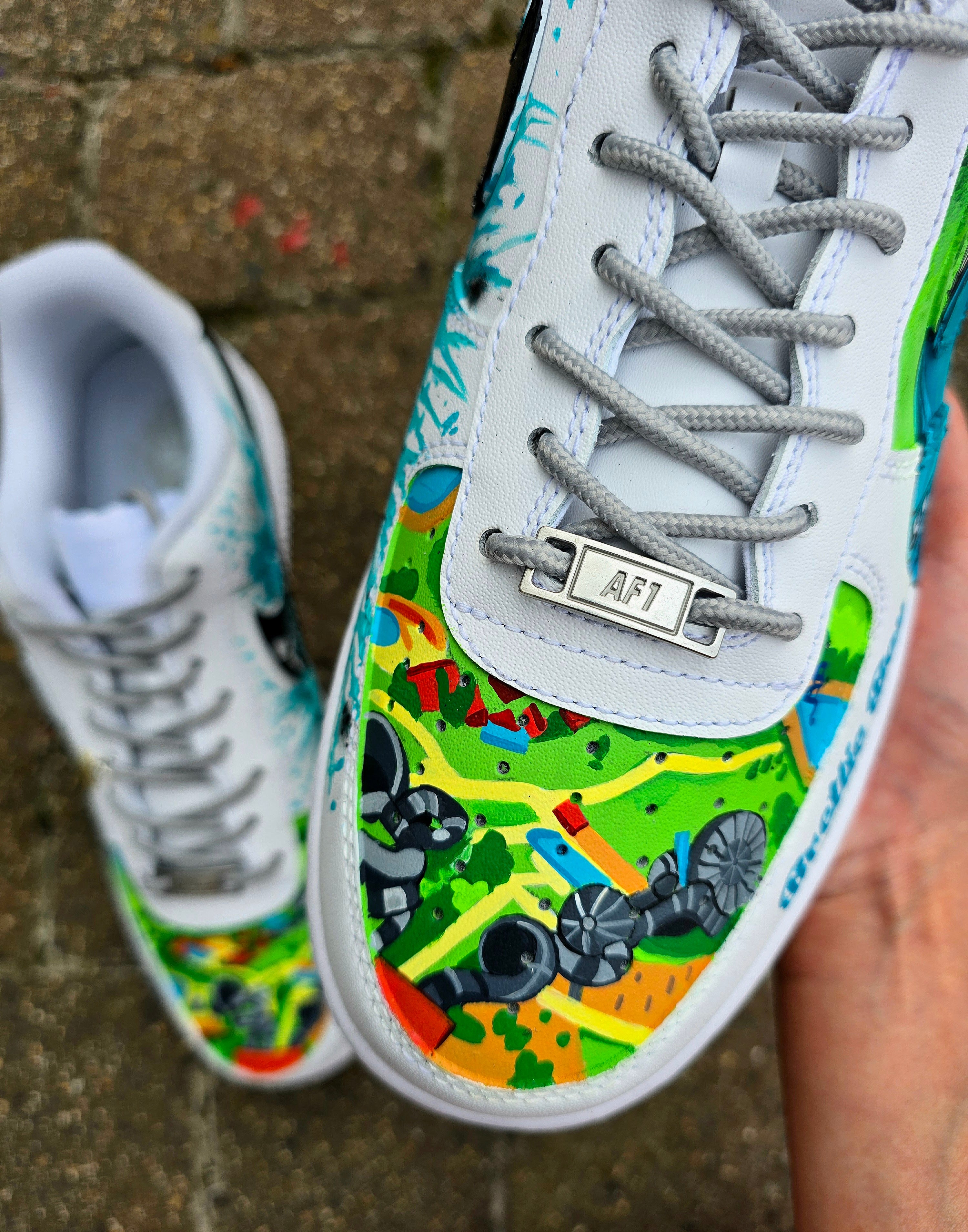 Custom hand-painted Nike Air Force 1 sneakers featuring a Lamborghini-inspired design 🏎️ and spray painter artwork 🎨. Created by Gitartsy using premium leather paints, sealed for durability, and fully customisable with personal details such as car models, colors, and text. Perfect for car enthusiasts 🚗, sneaker collectors 👟, and streetwear lovers seeking one-of-a-kind footwear.

