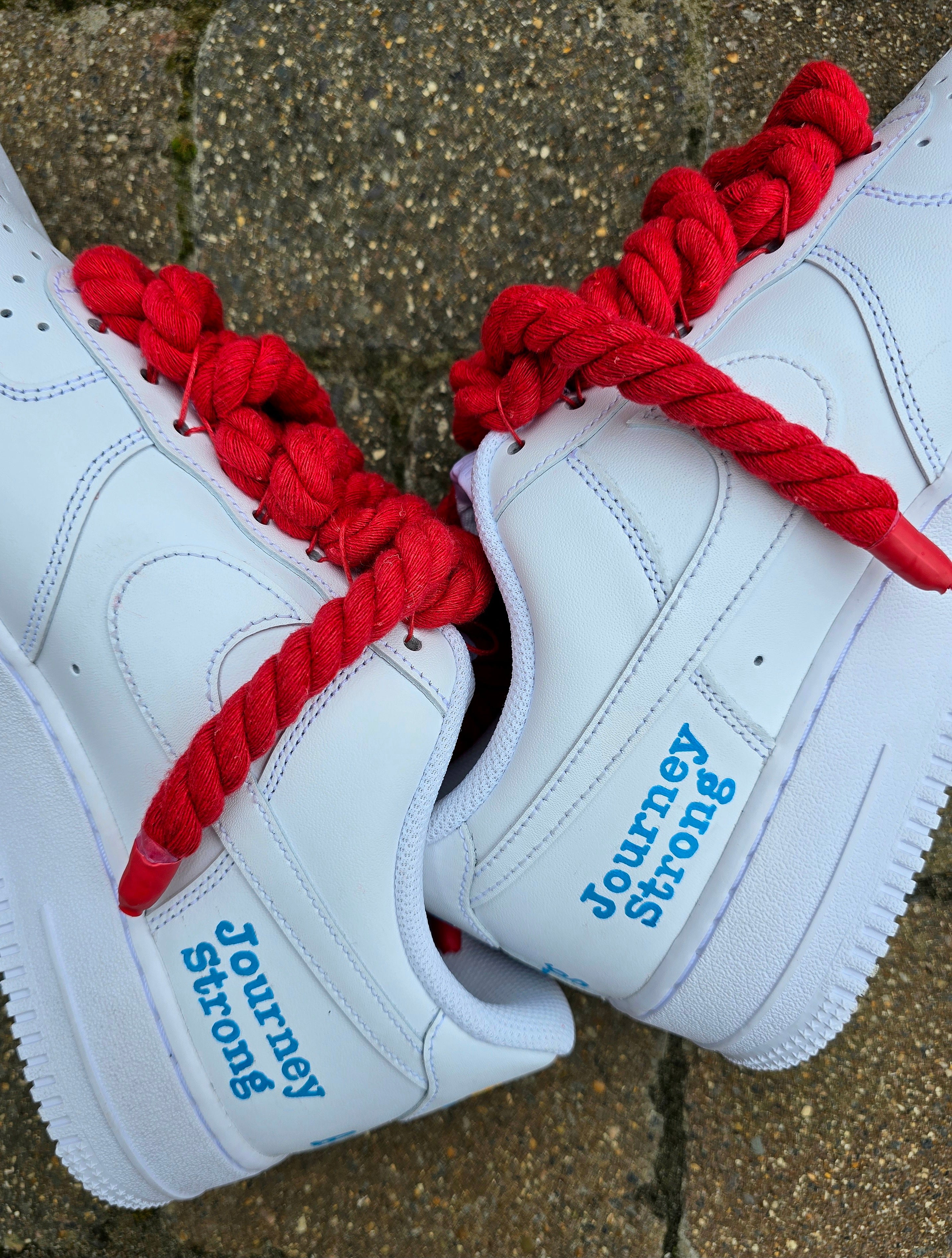 Custom hand-painted Nike Air Force 1 sneakers featuring unique cartoon artwork inspired by the book Who Stole Your Mind? by Being Alphie. The shoes showcase vibrant illustrations, bright yellow swoosh drips, thick red rope laces, and hand-lettered text on premium leather for book lovers, art collectors, and streetwear fans.

