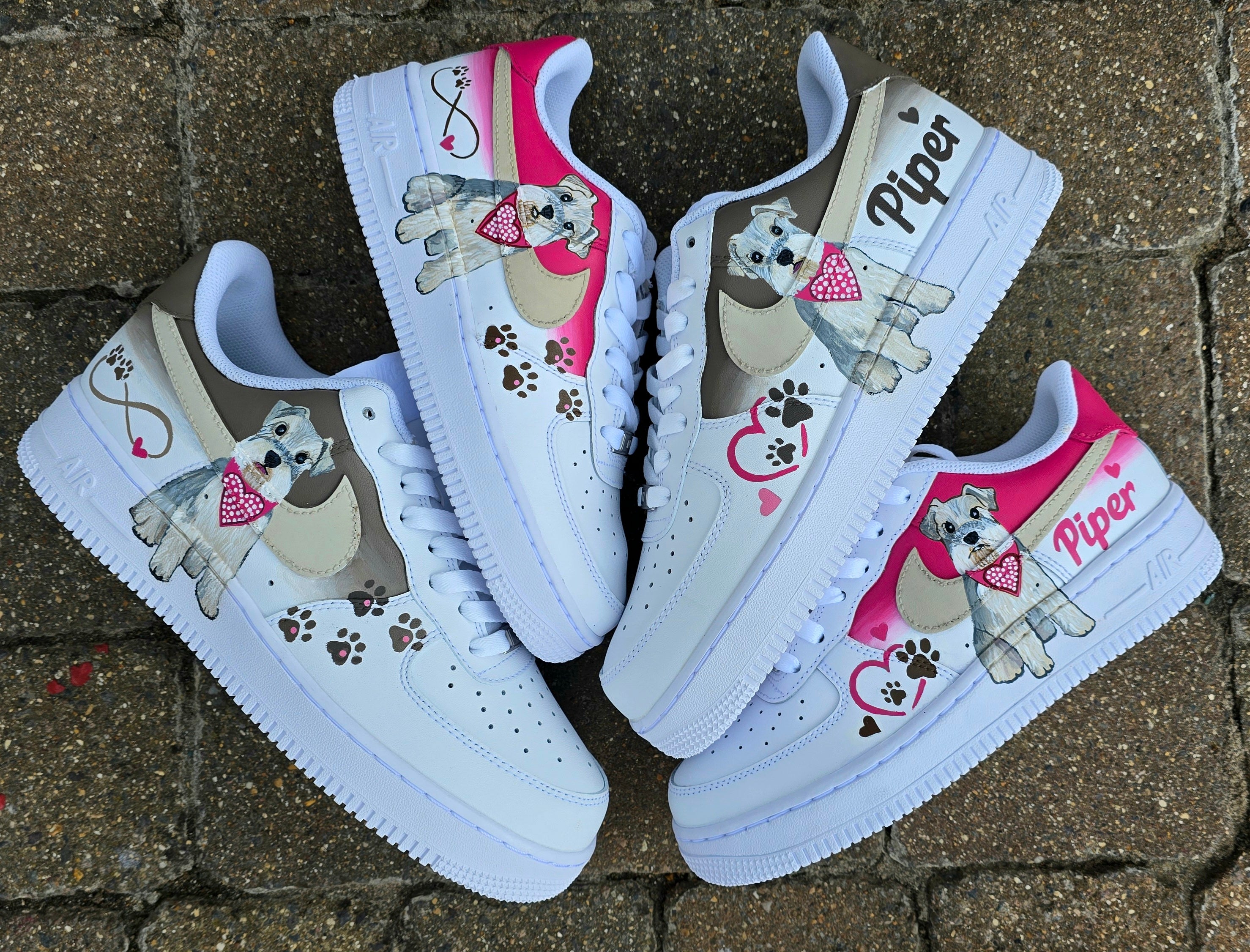 Hand-painted Nike Air Force 1 custom sneakers featuring a realistic pet portrait of “Piper” the dog 🐾, pink or taupe background, heart ❤️ and paw print accents, and personalised name detail, created by Gitartsy.

