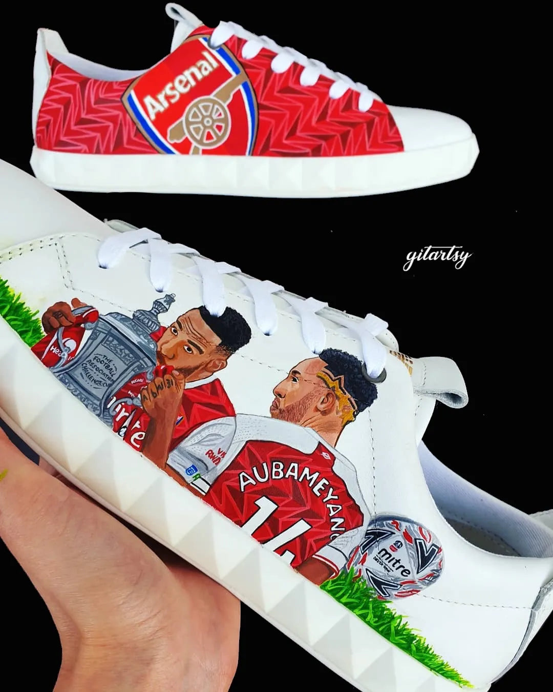 Realistic portraits of footballer Pierre-Emerick Aubameyang and Arsenal FC logo hand painted on white Armani sneakers shoes
