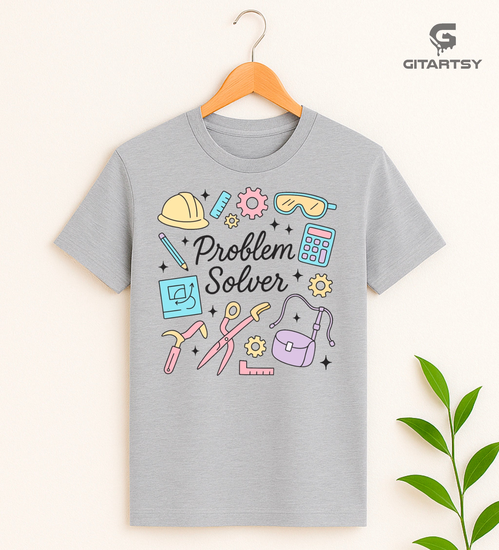 Pastel graphic T-shirt with "Problem Solver" text surrounded by icons of tools, calculator, hard hat, and ruler – ideal for handywomen, DIY lovers, and engineers.