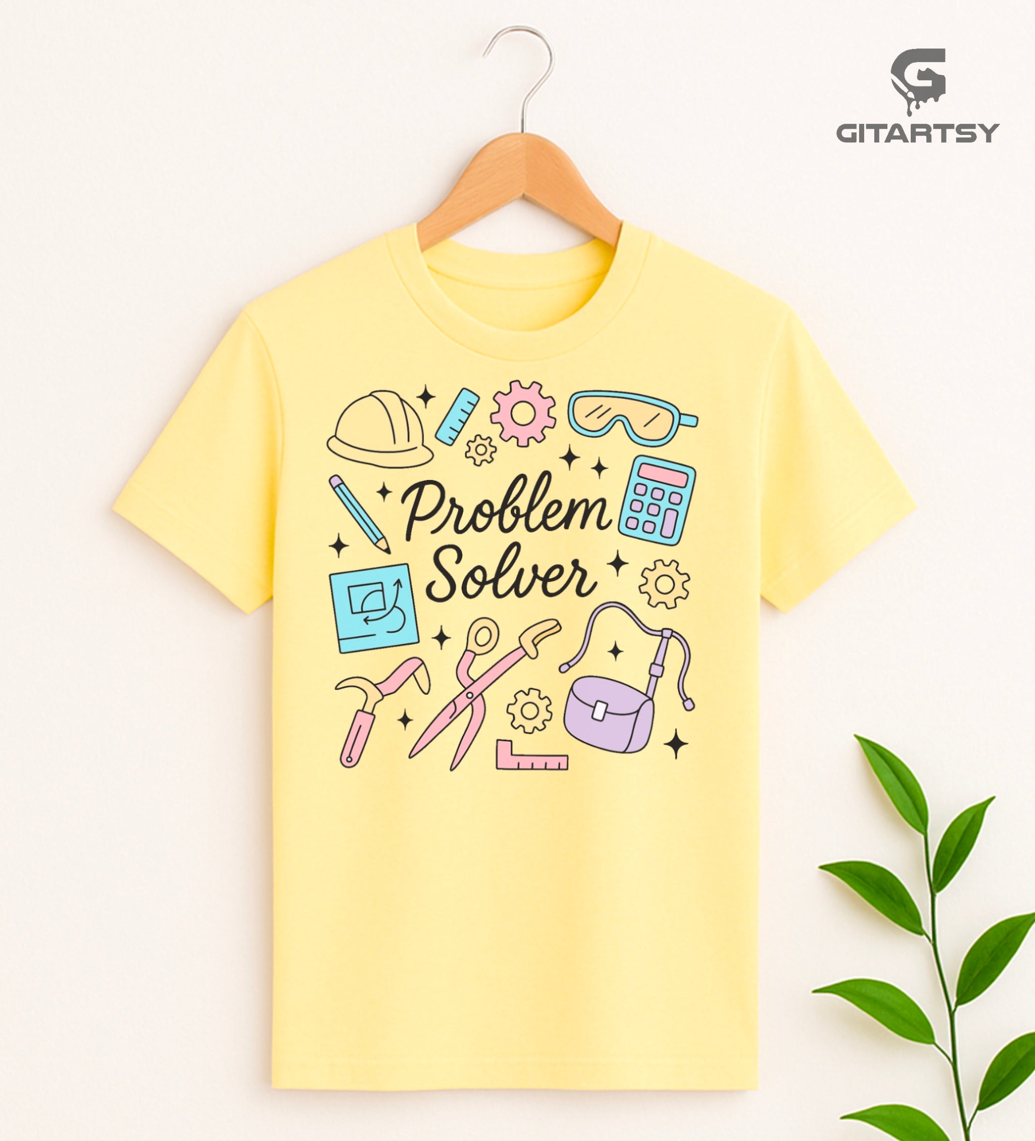 Pastel graphic T-shirt with "Problem Solver" text surrounded by icons of tools, calculator, hard hat, and ruler – ideal for handywomen, DIY lovers, and engineers.