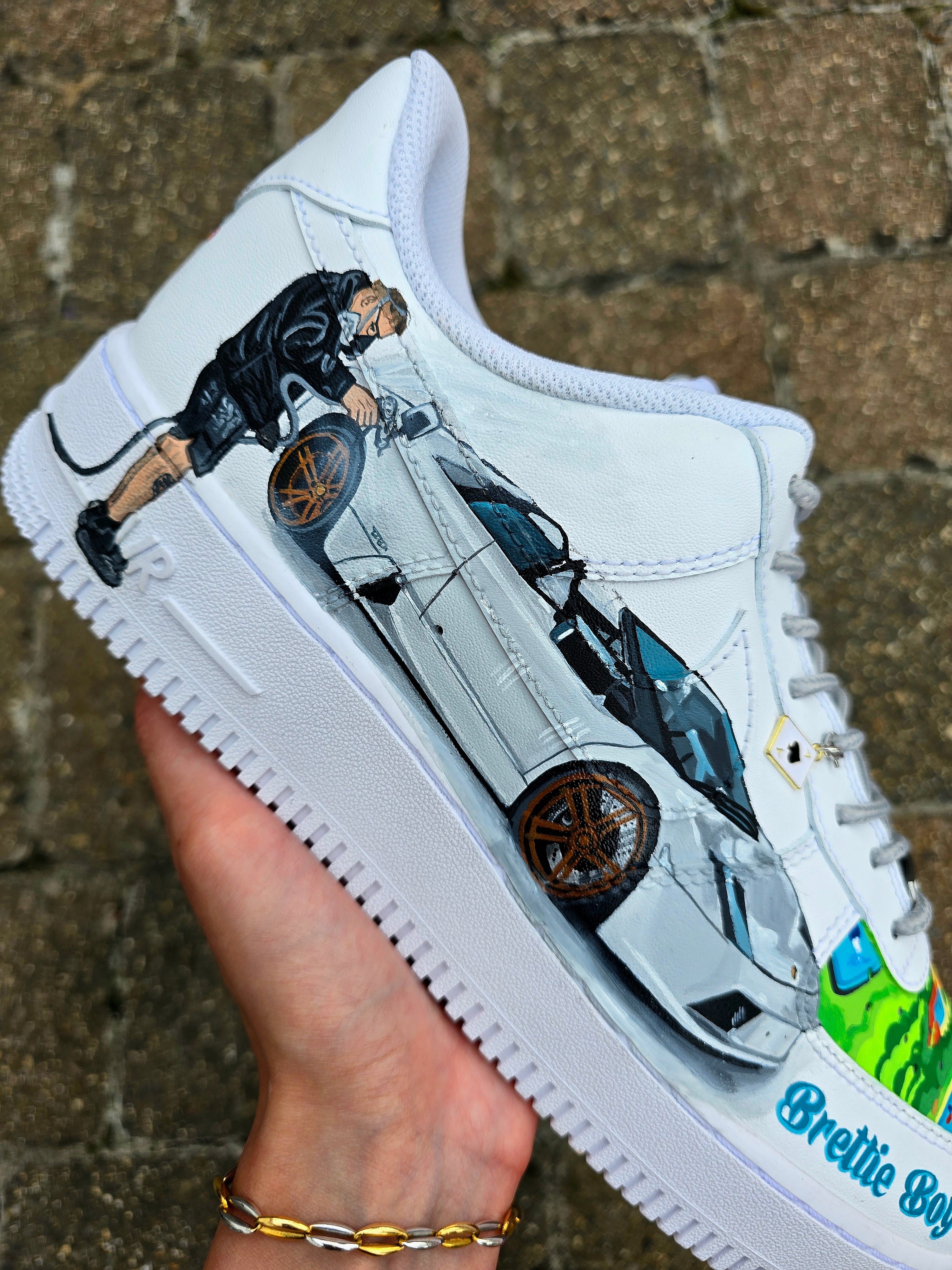 Custom hand-painted Nike Air Force 1 sneakers featuring a Lamborghini-inspired design 🏎️ and spray painter artwork 🎨. Created by Gitartsy using premium leather paints, sealed for durability, and fully customisable with personal details such as car models, colors, and text. Perfect for car enthusiasts 🚗, sneaker collectors 👟, and streetwear lovers seeking one-of-a-kind footwear.

