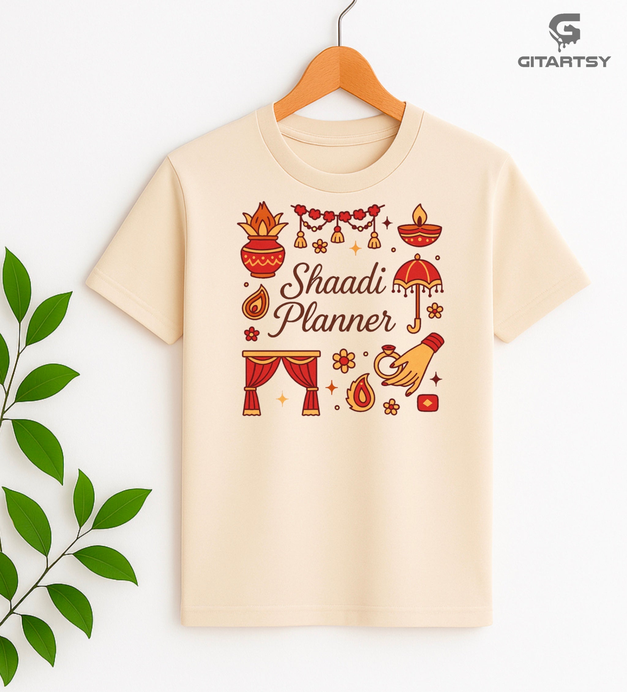 T-shirt with Shaadi Planner text and Indian wedding icons like diya, kalash, mandap, and hand with ring – perfect for desi wedding planners