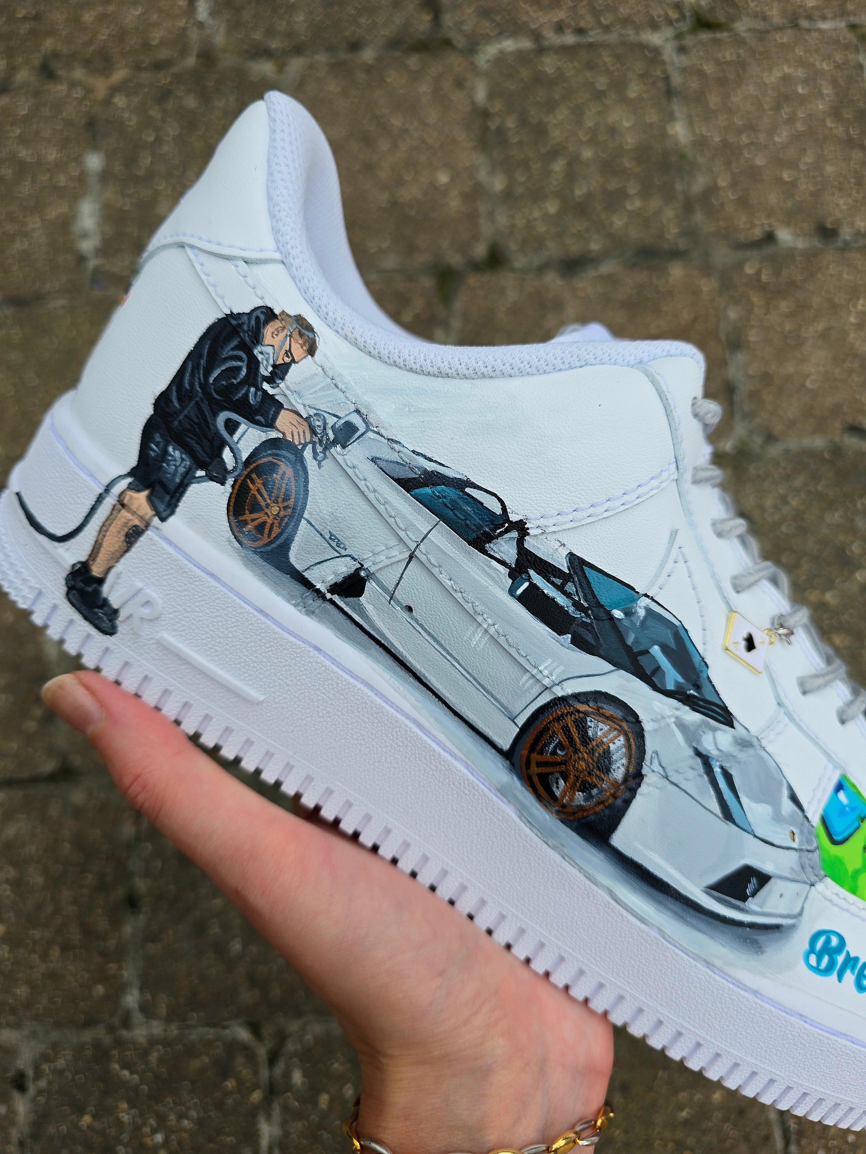 Custom hand-painted Nike Air Force 1 sneakers featuring a Lamborghini-inspired design 🏎️ and spray painter artwork 🎨. Created by Gitartsy using premium leather paints, sealed for durability, and fully customisable with personal details such as car models, colors, and text. Perfect for car enthusiasts 🚗, sneaker collectors 👟, and streetwear lovers seeking one-of-a-kind footwear.

