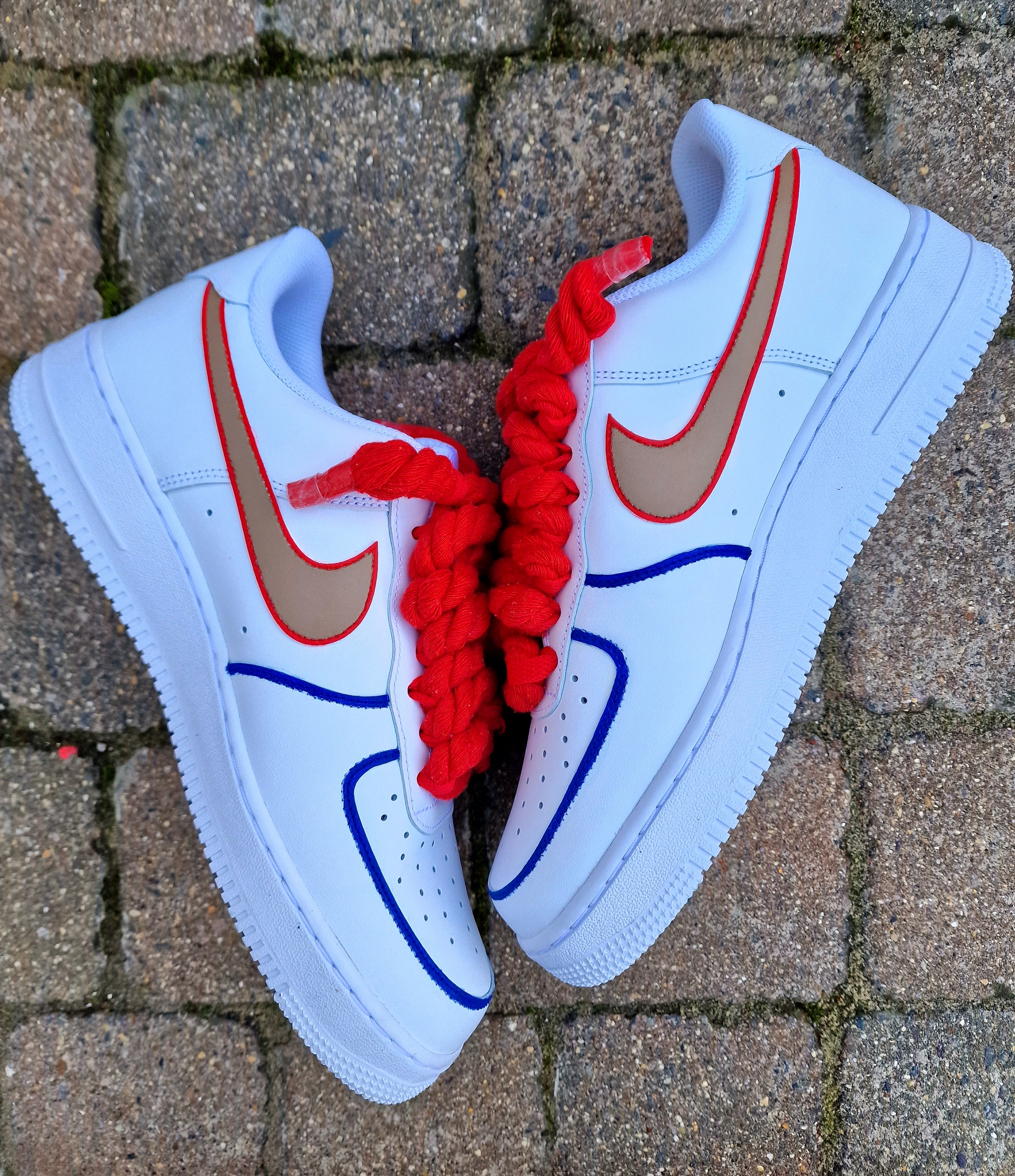 Hand-painted custom Nike Air Force 1 sneakers featuring Arsenal legend Thierry Henry, the Arsenal crest, Premier League trophy, and bold red laces. Perfect for Arsenal fans and football sneaker collectors.

