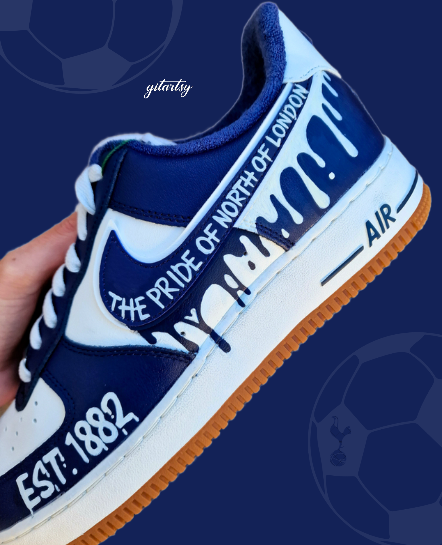 Custom hand-painted Nike Air Force 1 sneakers in navy and white featuring Tottenham Hotspur-inspired artwork, paint drip design, and fan chants including “COYS”, “The Pride of North of London”, “I Wanna Be In That Number”, and “Est. 1882”, created by Gitartsy with premium leather paint and sealing for durability and vibrancy.

