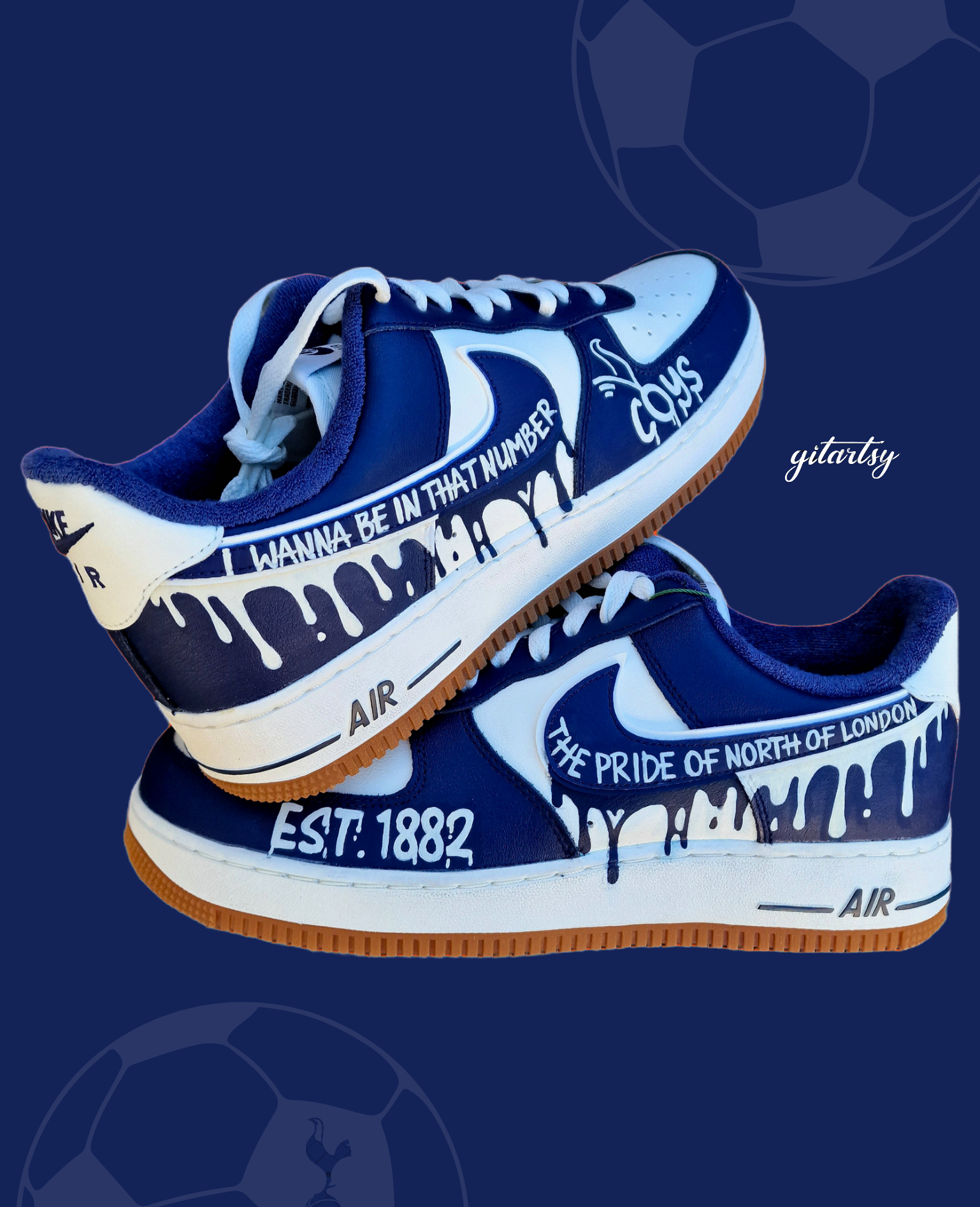 Custom hand-painted Nike Air Force 1 sneakers in navy and white featuring Tottenham Hotspur-inspired artwork, paint drip design, and fan chants including “COYS”, “The Pride of North of London”, “I Wanna Be In That Number”, and “Est. 1882”, created by Gitartsy with premium leather paint and sealing for durability and vibrancy.

