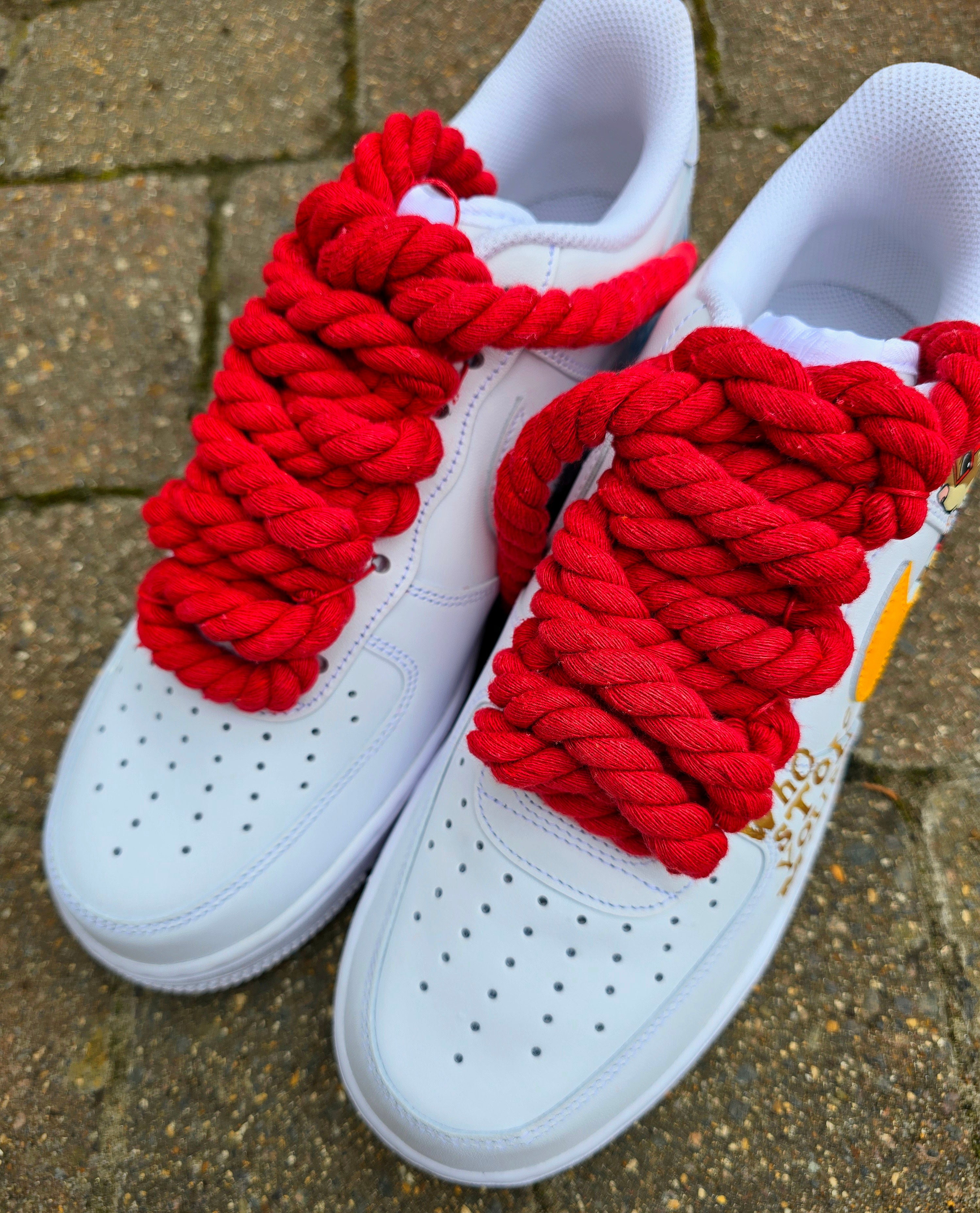 Custom hand-painted Nike Air Force 1 sneakers featuring unique cartoon artwork inspired by the book Who Stole Your Mind? by Being Alphie. The shoes showcase vibrant illustrations, bright yellow swoosh drips, thick red rope laces, and hand-lettered text on premium leather for book lovers, art collectors, and streetwear fans.

