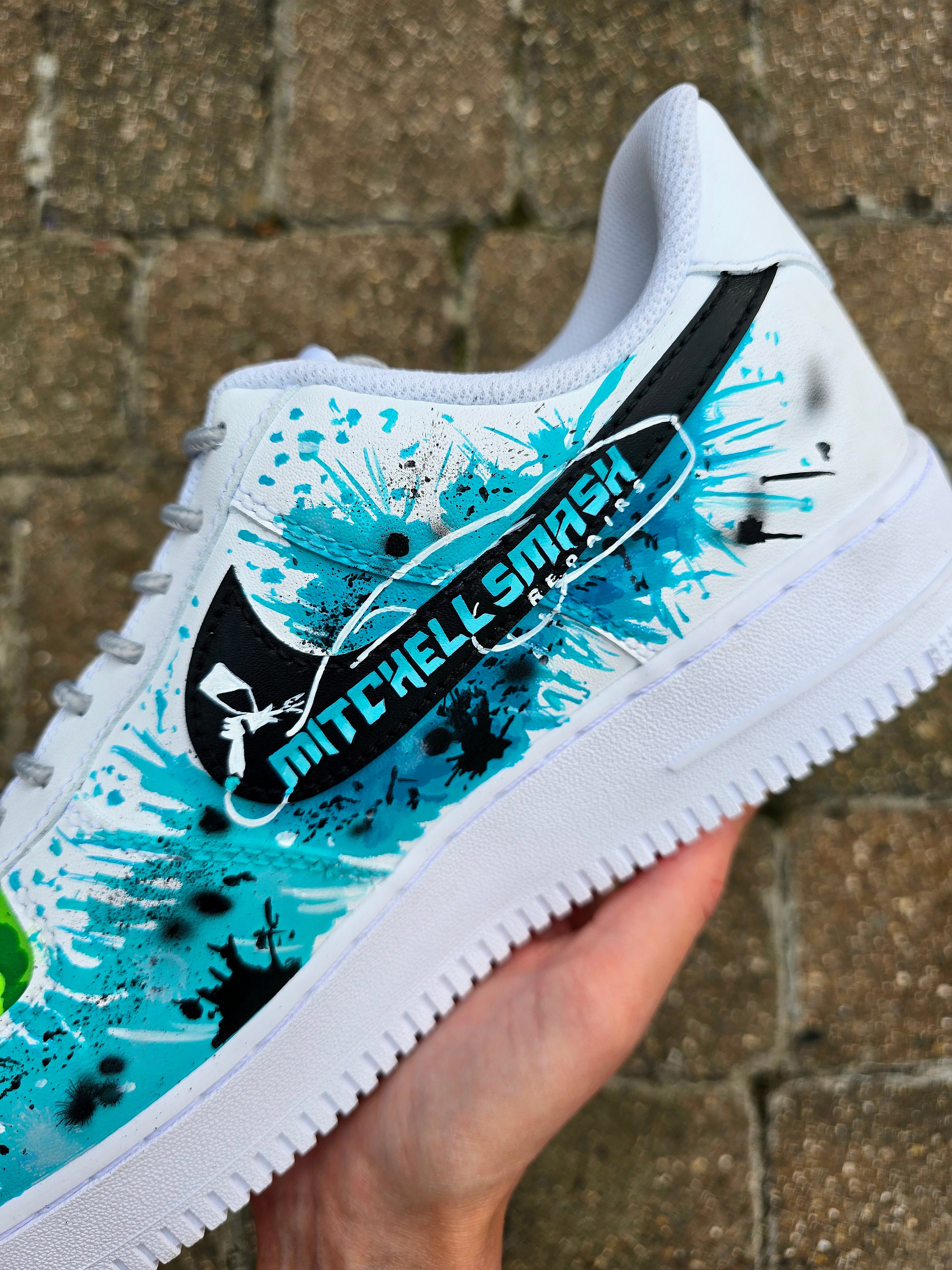 Custom hand-painted Nike Air Force 1 sneakers featuring a Lamborghini-inspired design 🏎️ and spray painter artwork 🎨. Created by Gitartsy using premium leather paints, sealed for durability, and fully customisable with personal details such as car models, colors, and text. Perfect for car enthusiasts 🚗, sneaker collectors 👟, and streetwear lovers seeking one-of-a-kind footwear.

