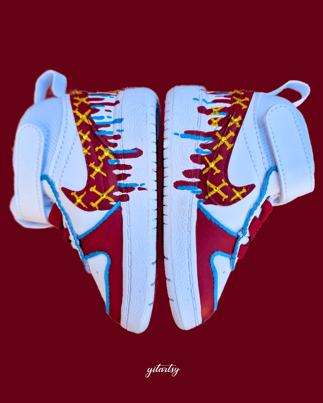 Custom hand-painted baby sneakers inspired by West Ham United, featuring claret and blue color detailing, dripping paint effect, crossed hammers, and personalised names or messages on the straps. Perfect for infant football fans and thoughtful baby gifts.

