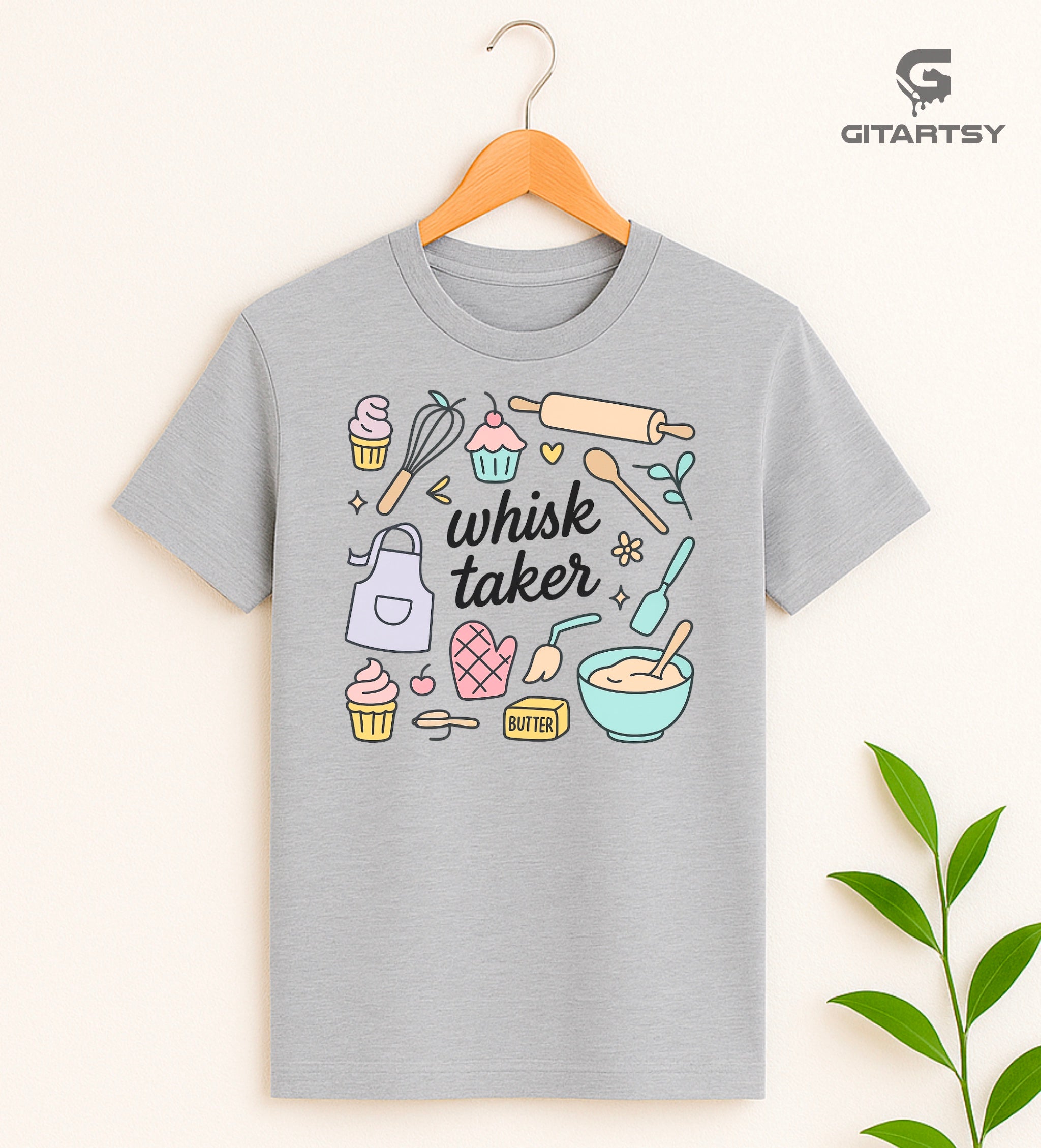 Pastel gray T-shirt with baking-themed illustrations and the quote "Whisk Taker" – ideal for bakers, chefs, and dessert lovers
